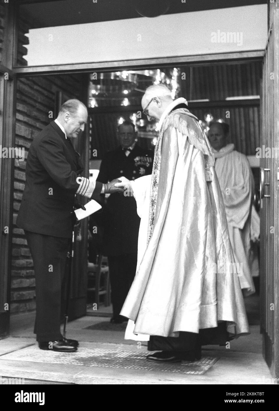 Copenhagen, Denmark 19581123. The new Norwegian Sailor Church King Haakon's church in Copenhagen was inaugurated with King Olav present. Outside the church, many Danes had arrived and the Norwegian king's guard played during the event. Here King Olav greets Bishop Johs. Smemo. Photo: NTB Archive / NTB Stock Photo
