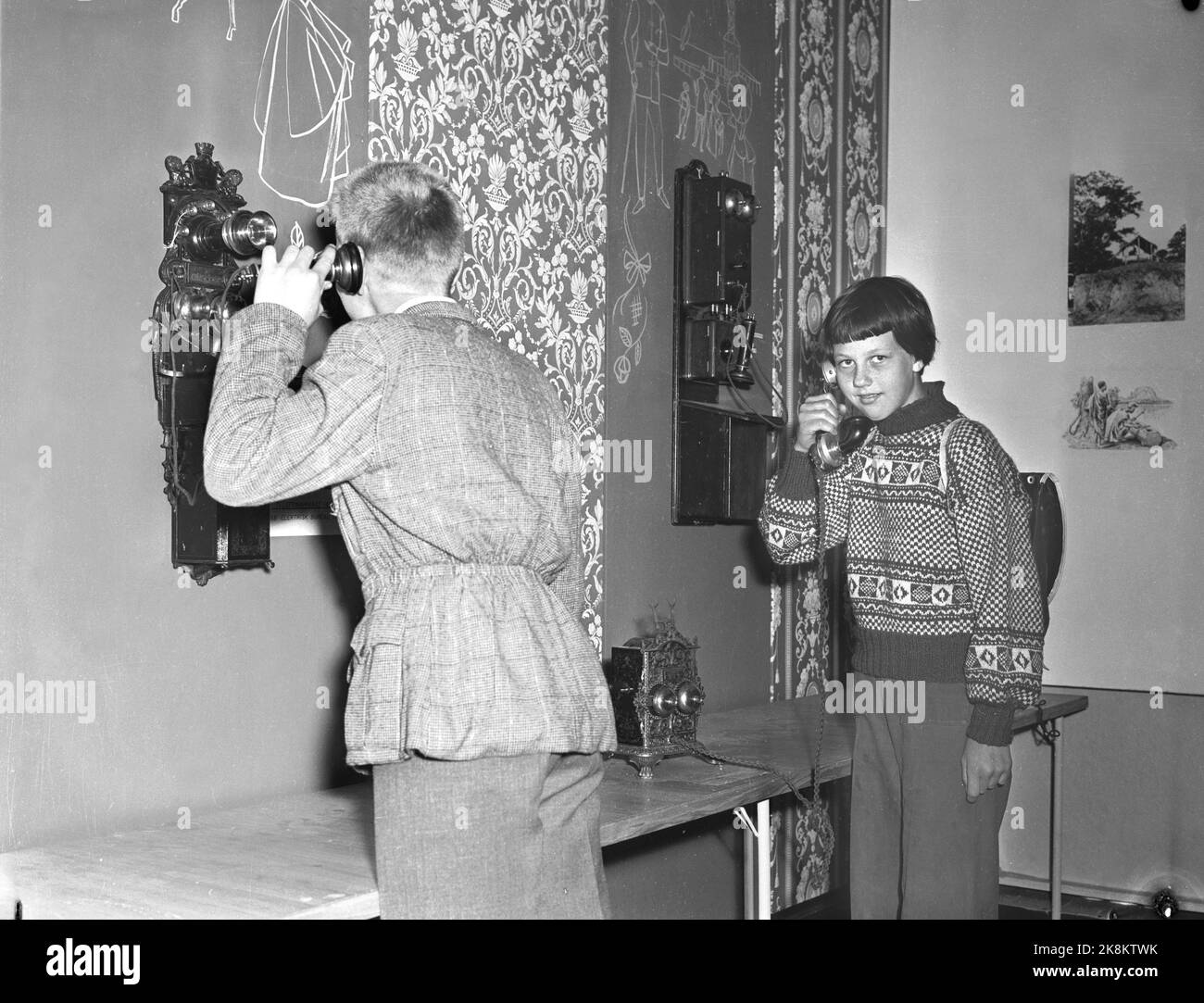 Oslo 19550613. The exhibition 'Thread and Wireless' in connection with the Telegraph Agency's 100th anniversary. Here children who talk on the phone. Photo: Jan Stage NTB / NTB Stock Photo