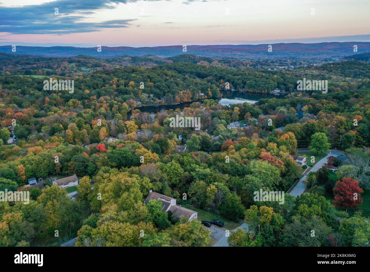 Brilliant Sunset in early fall over Lake Neepaulin in Sussex County NJ aerial Stock Photo