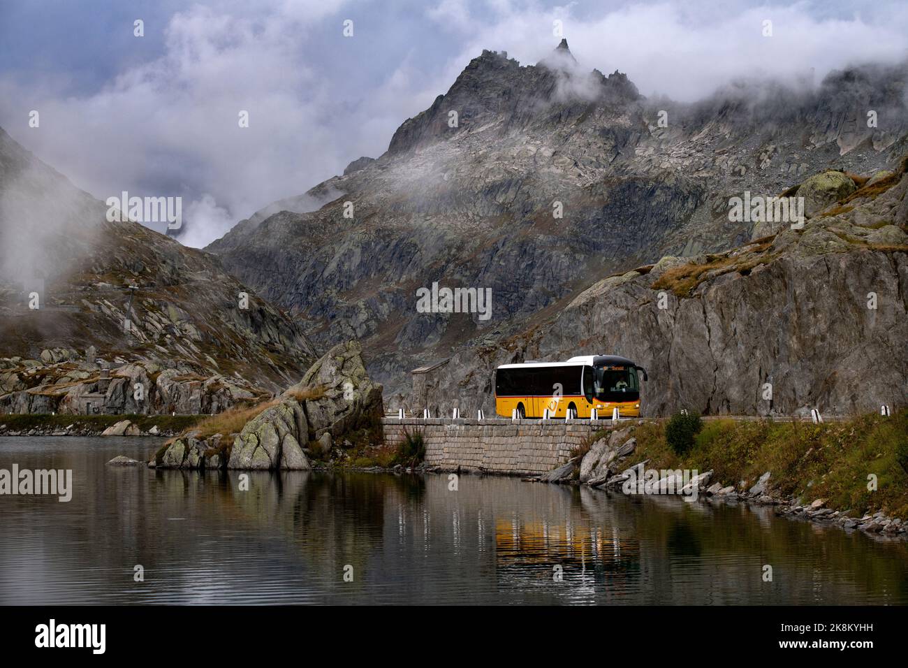 Post Bus at summit of the The Grimsel Pass: Grimselpass; Col du Grimsel;: Passo del Grimsel is a mountain pass in Switzerland, crossing the Bernese Al Stock Photo