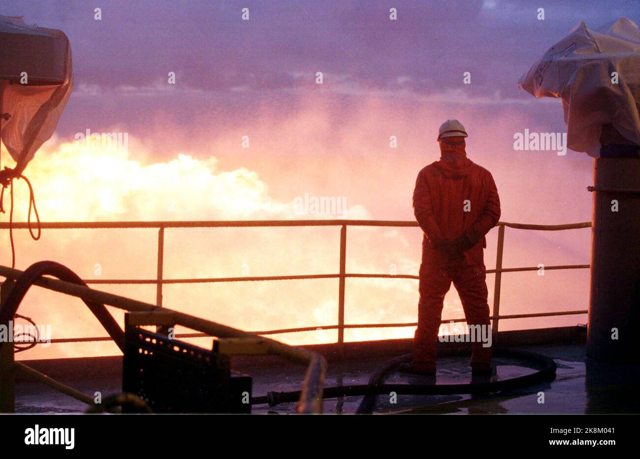 The North Sea 1998-04-01 Amoco has made a promising oil and gas discovery at Haltenbanken, north of the Heidrun field and the Åsgard area. The picture shows the exploration rig Maersk Jutlander during the sample drilling on April 1, 1998. Gas flame, oil work in the backlight against the gas flame. Photo: Erik Johansen / NTB Stock Photo