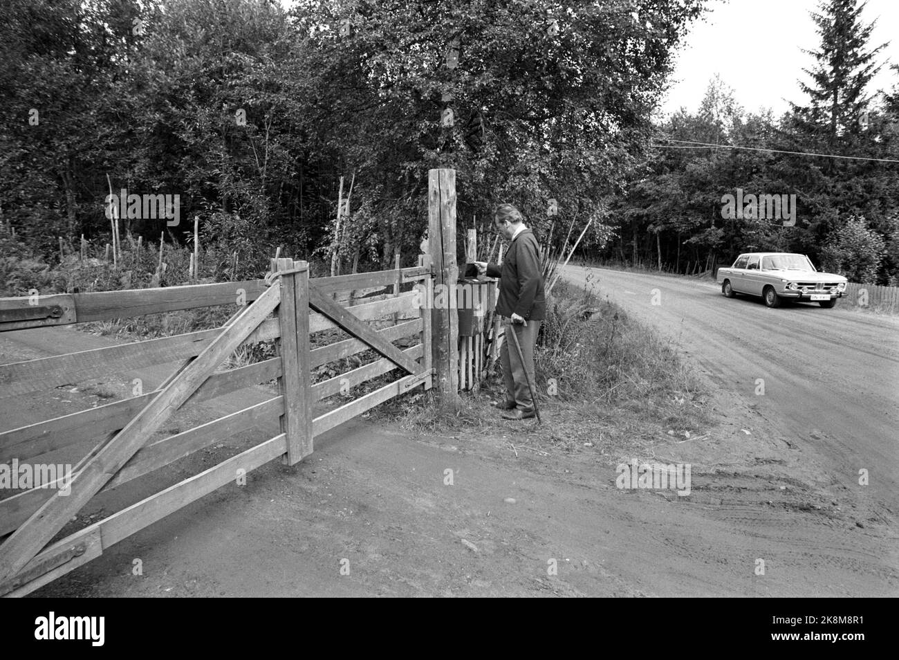 Hamar in the summer of 1970. West Germany's Chancellor Willy Brandt and Mrs. Rut Brandt bought a cabin in Vangsåsen in 1965 at Hamar, and here they spend their summer holidays with the family. Here, the Chancellor picks up the post at Gåsbu, and pays tolls to be able to drive inland. Photo: Ivar Aaserud / Current / NTB Stock Photo