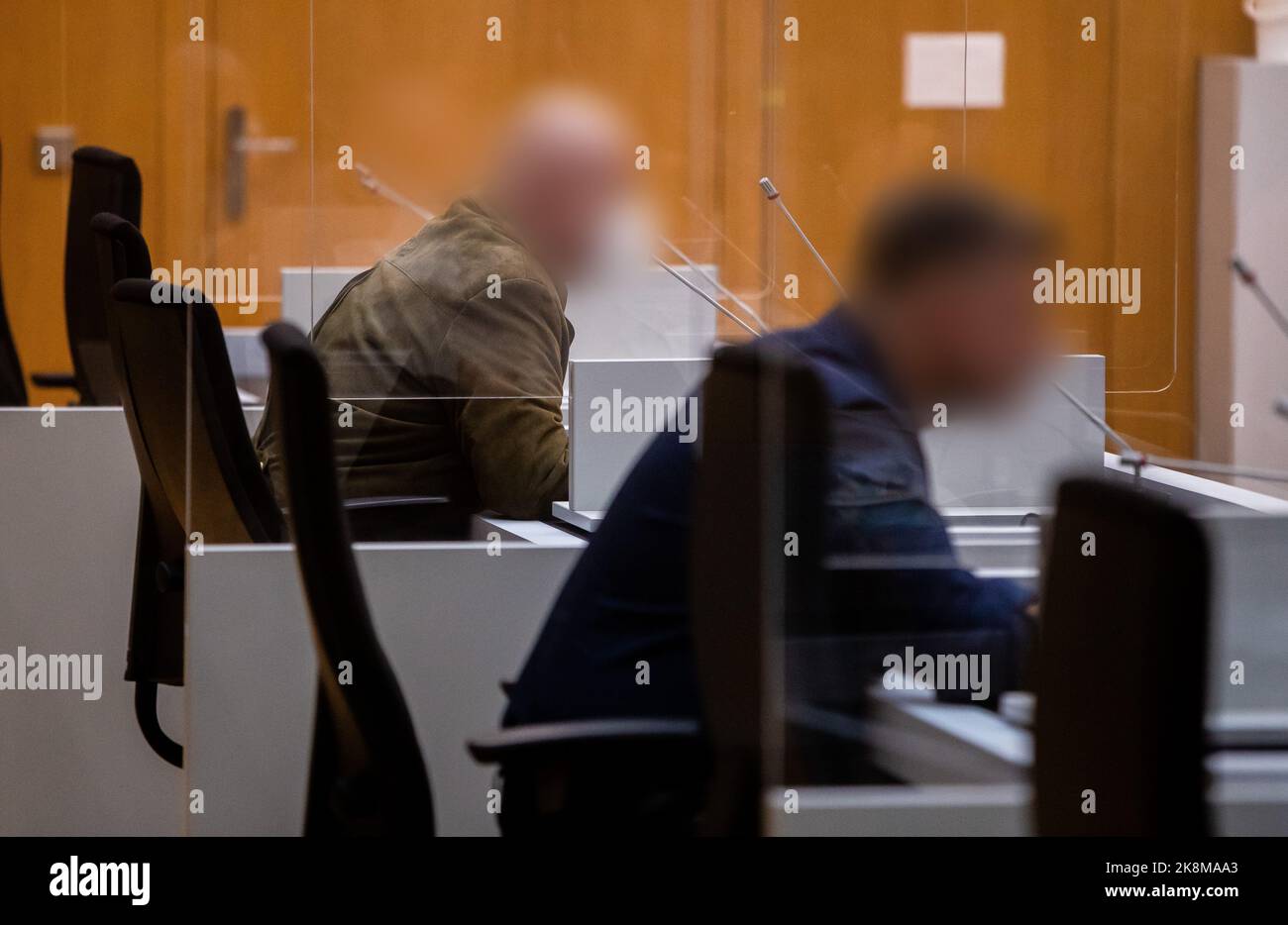 Stuttgart, Germany. 24th Oct, 2022. Two defendants sit in their seats ...