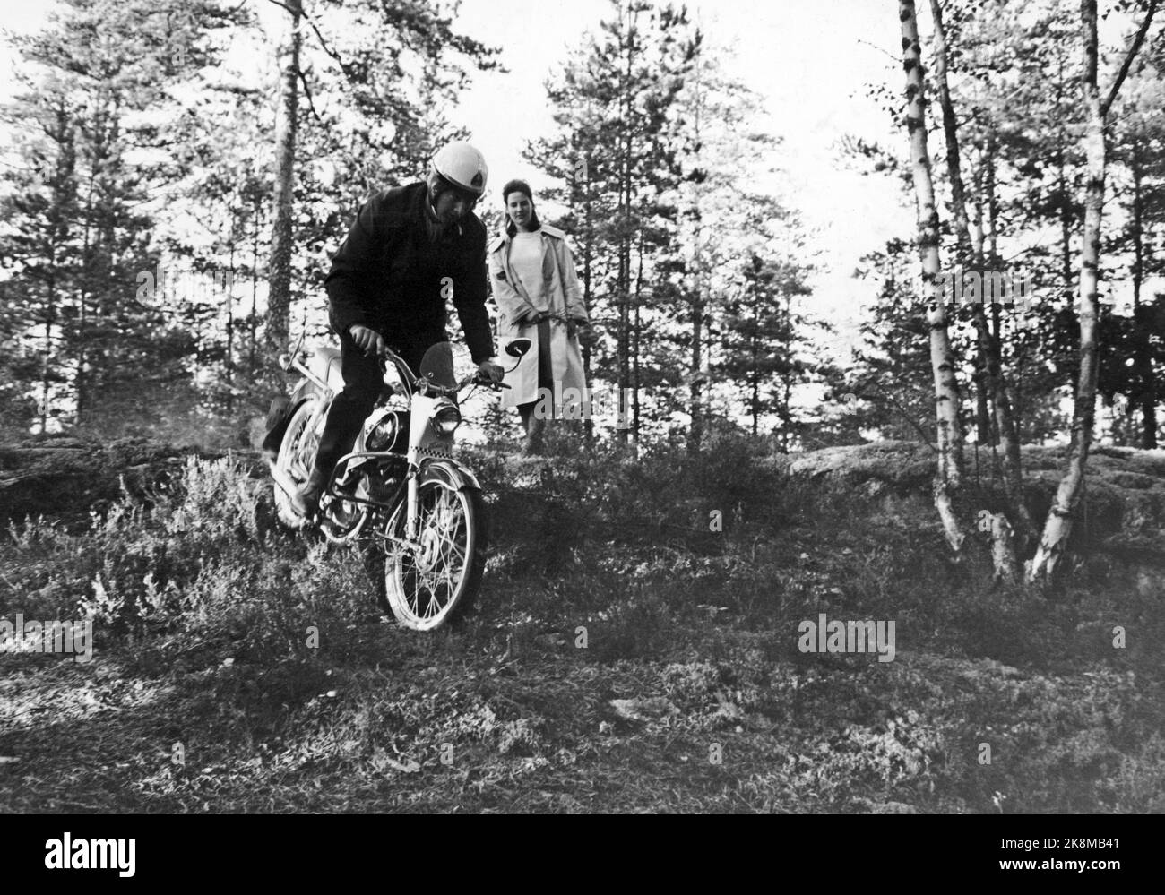 Oslo, Hvervenbukta 1963. Full speed in Motorkauen. The Oslo Youth Motorsenter is 13 km from the center of Oslo. Meeting room, workshop, terrain trail and hobby room are built with municipal support and impressive efforts by boys and girls in OMS. Sven Erik Nilsson, 18 years and car service, test runs the terrain trail. SPEW: Aud Solveig Aarberg Member of the girl group. Photo: Ivar Aaserud / Current / NTB Stock Photo