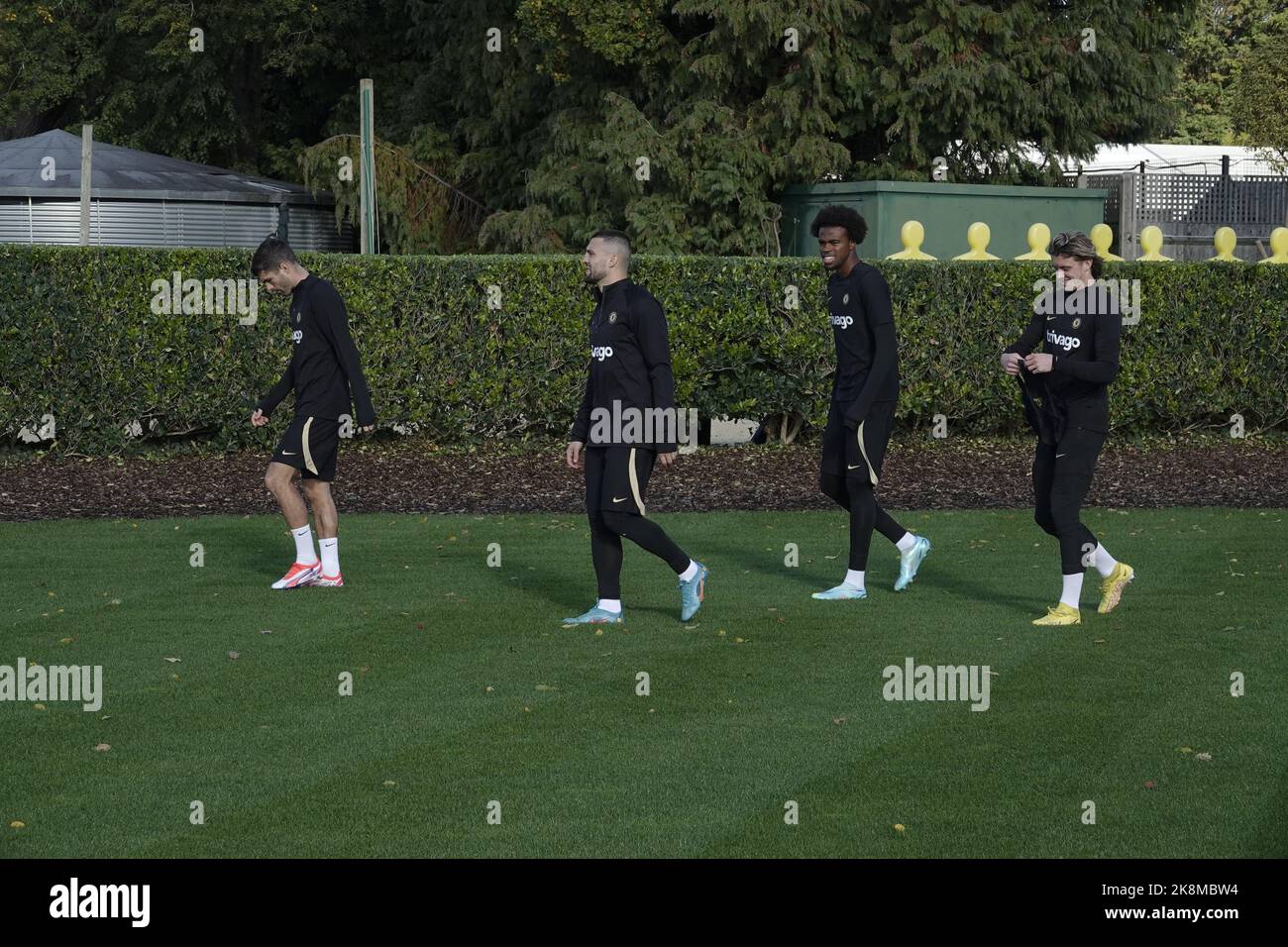 Cobham, Surrey, UK. 24th Oct, 2022. Chelsea Football Club players walk out for training at the clubsÕ Cobham training ground, for their Champions League game against FC Salzburg tomorrow in Austria Here : Christian Pulisic, leads Mateo Kovacic, Carney Chukwuemeka and Conor Gallagher Credit: Motofoto/Alamy Live News Stock Photo