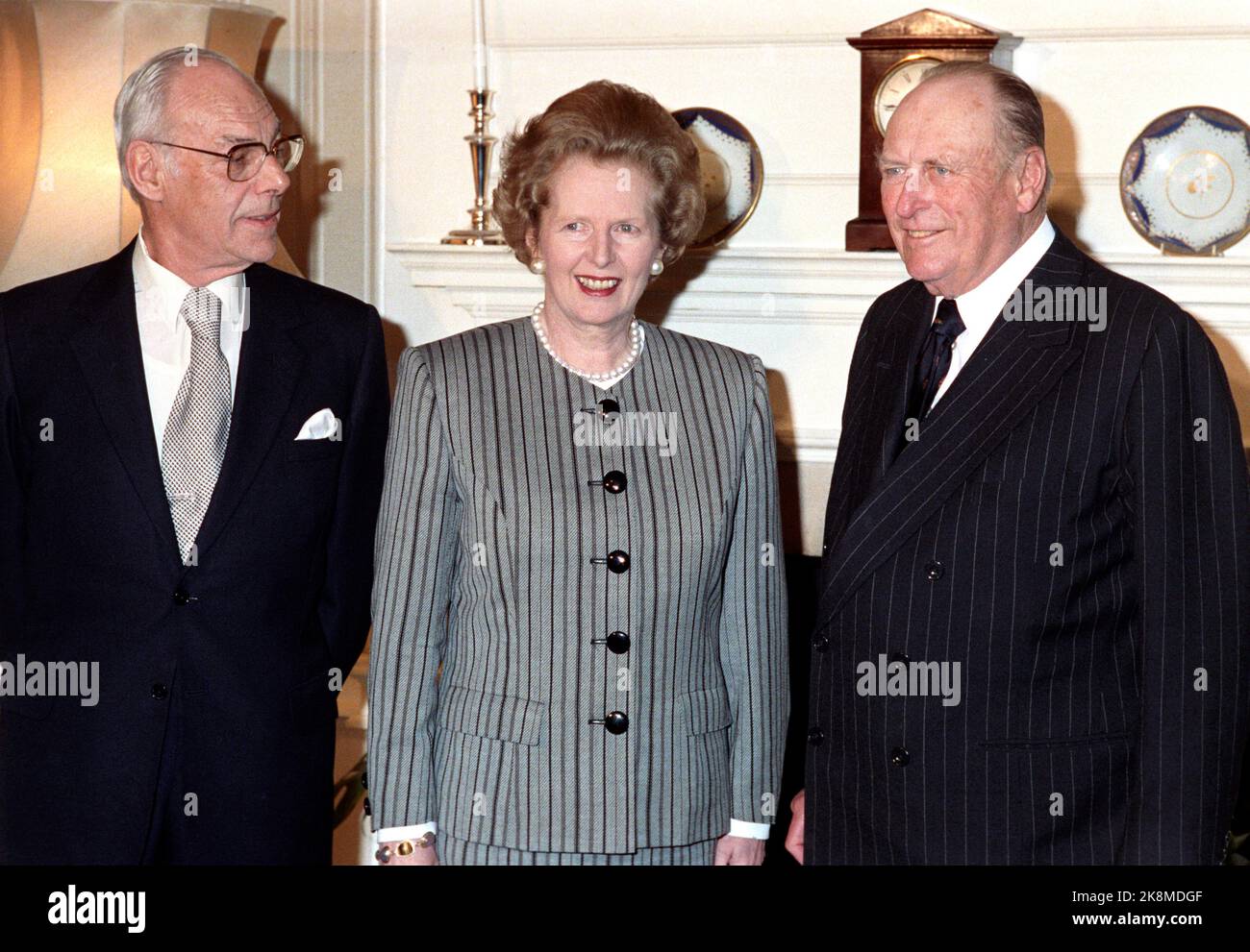 London, England 19880414. King Olav on an official visit to England. Here King Olav (t.h.) at lunch in Downing Street 10 with Prime Minister Margaret Thatcher and her husband Denis Thatcher (t.v.). NTB Stock Photo: Paul Owesen / NTB Stock Photo