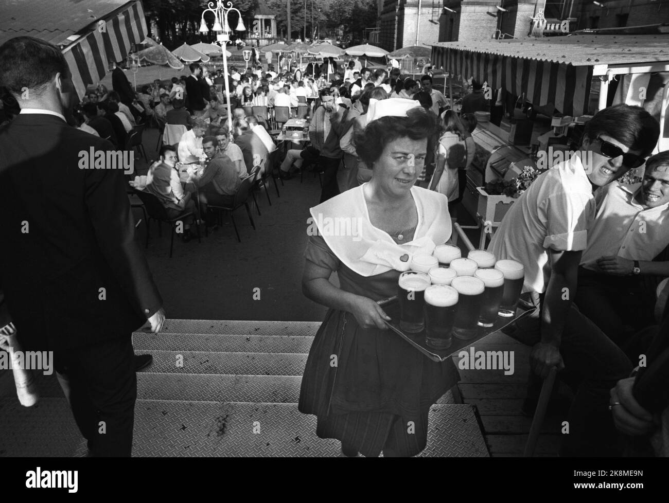 Oslo June 28, 1969. Karl Johansgate in Oslo on a hot summer day. Here from behind the National Theater where there was previously an outdoor restaurant who bore the name 'Pernille'. Here is a waitress with a barrel full of beer. Photo: Per Ervik / Current / NTB Stock Photo