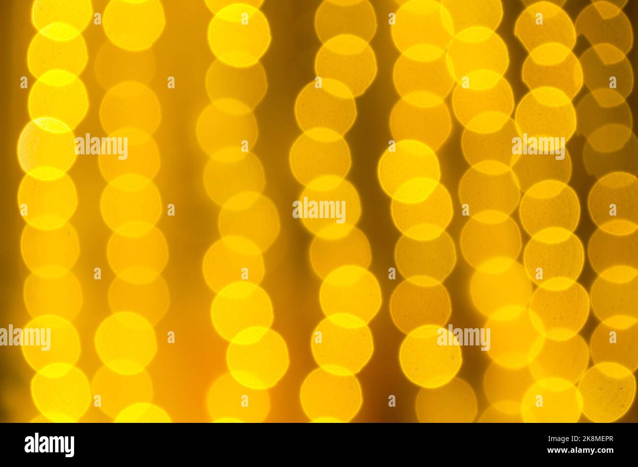 Christmas festive background, festive Christmas golden bokeh background. Holiday glowing color lights, blurred bright abstract bokeh Stock Photo
