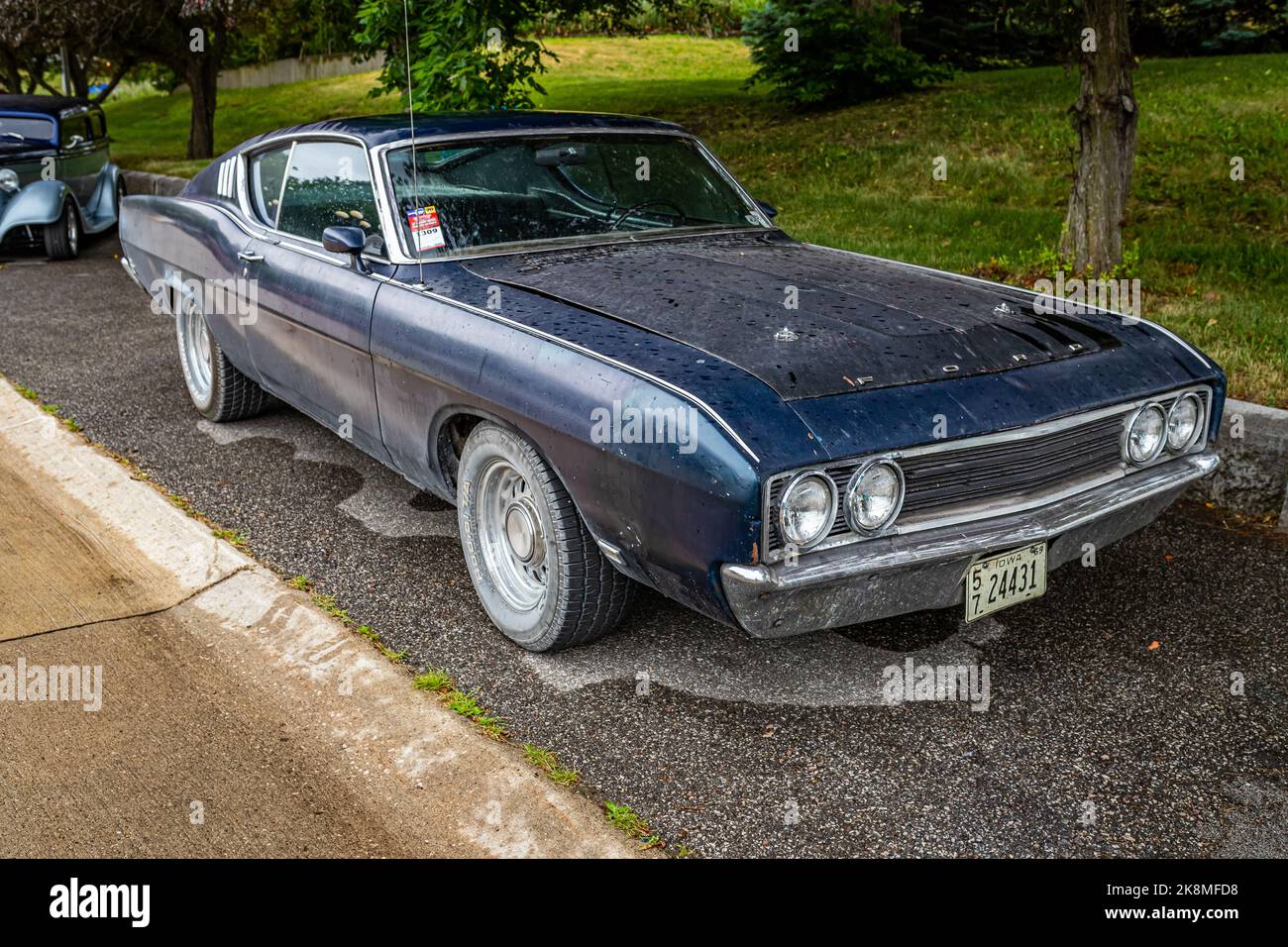 Des Moines, IA - July 01, 2022: High perspective front corner view of a 1969 Ford Torino Talladega 428 Coupe at a local car show. Stock Photo