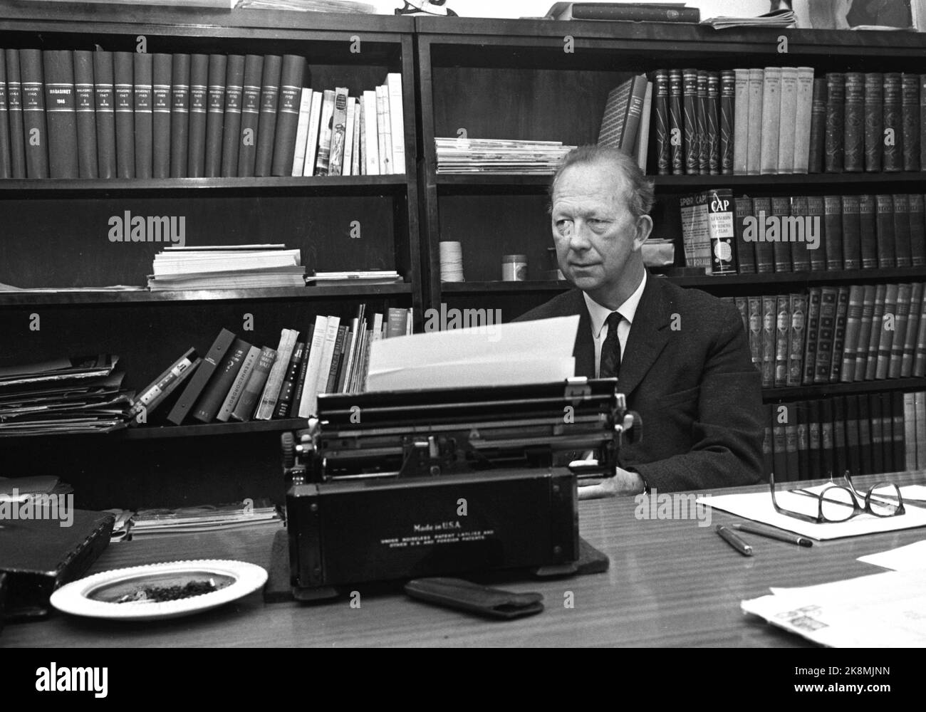 Oslo 1963. Author Nils Johan Rud sits in his office by the typewriter ...