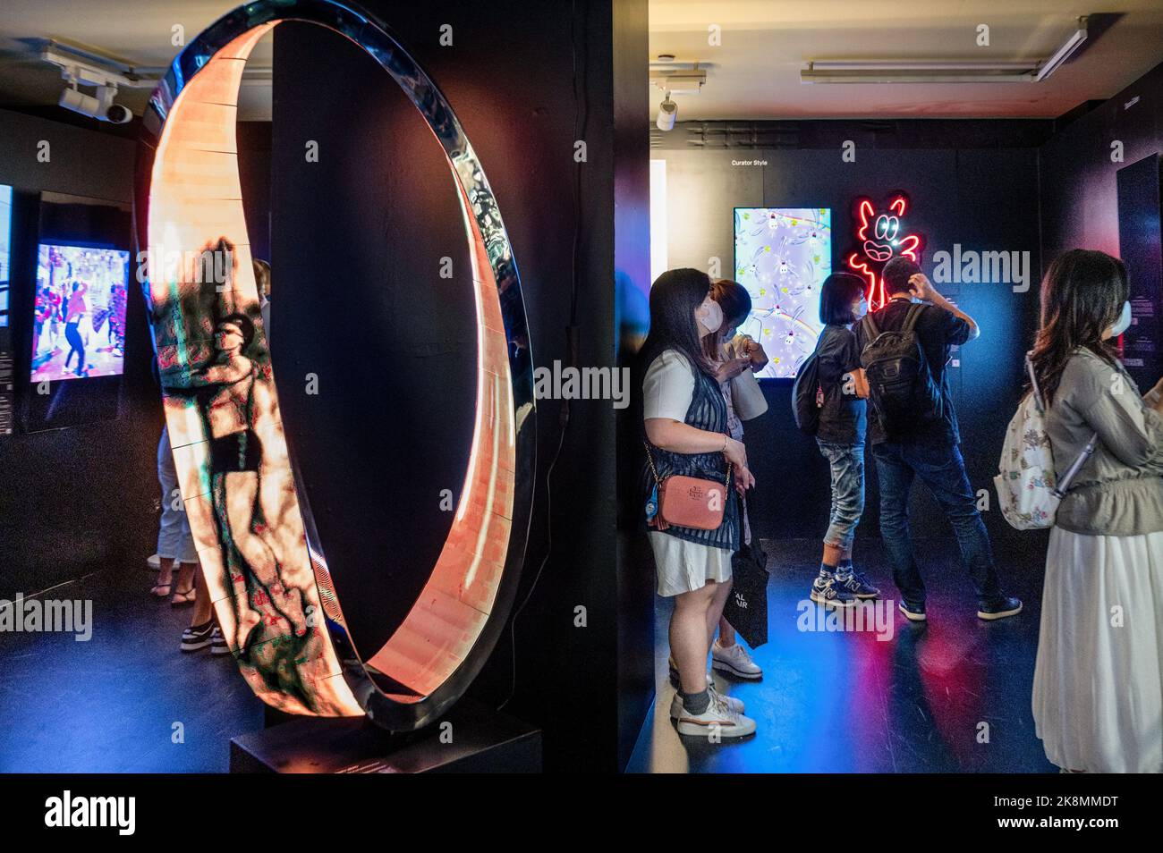Hong Kong, China. 22nd Oct, 2022. Visitors look at artworks during the