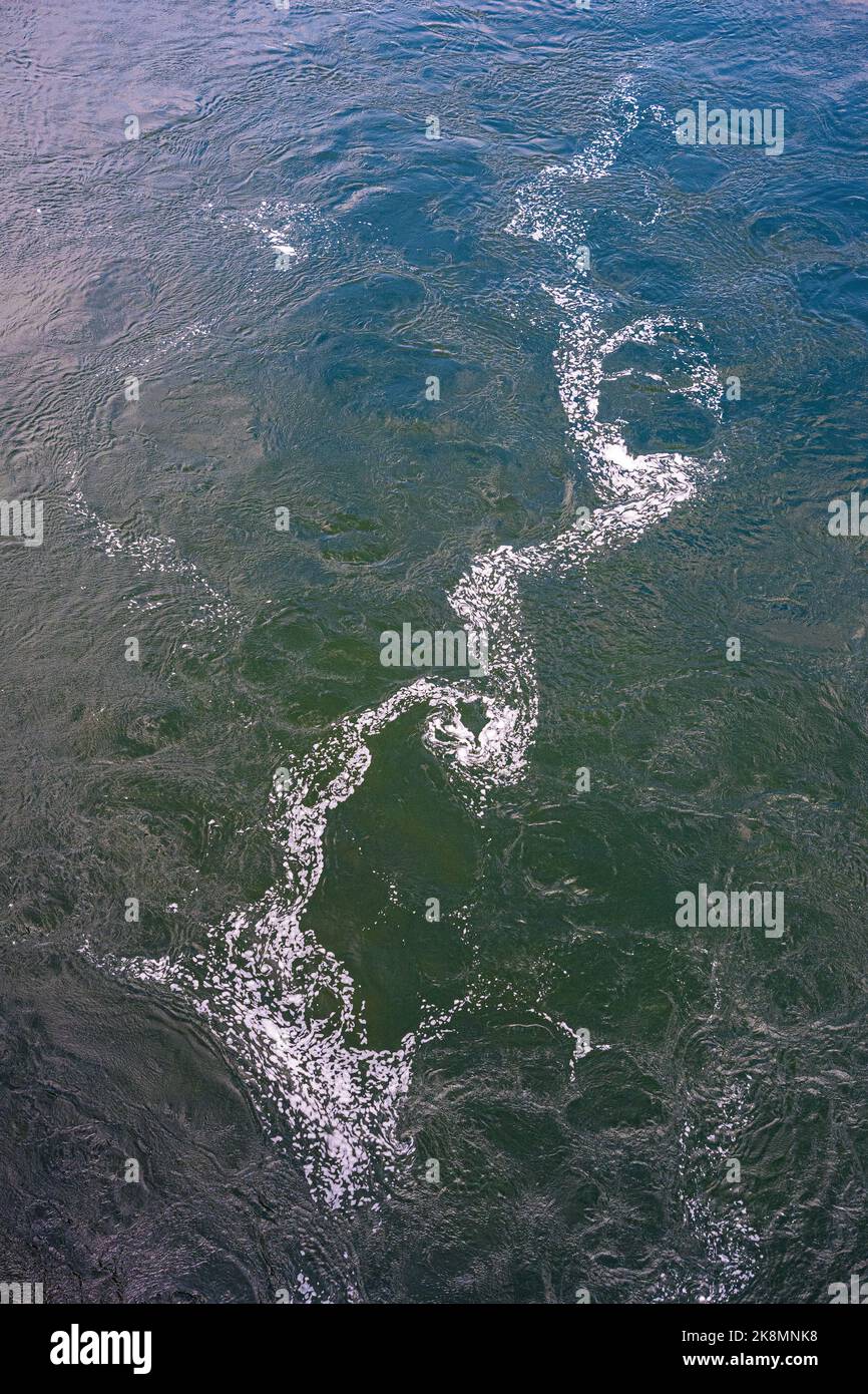 White foam pattern on the surface of the GudbrandsdalslÃ¥gen River, Oppland, Norway. Stock Photo