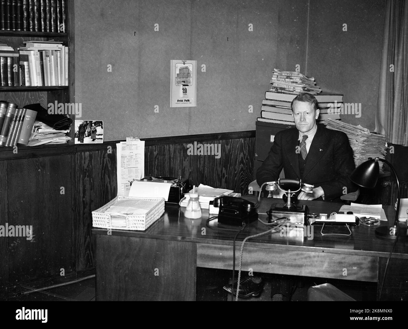 WW2 Oslo 19411120 Editor Arnt Rishovd (1937-1944) in free people at the desk in their office. Free people, main body for the National Assembly, published 1936-45. The newspaper started as a daily newspaper in Oslo, but came as a weekly magazine until March 30, 1940, when it began to publish again every day. Last edition published May 7, 1945. (Source: Large Norwegian Lexicon.) Photo: Johnsen / NTB *** Photo not image processed ***** Stock Photo