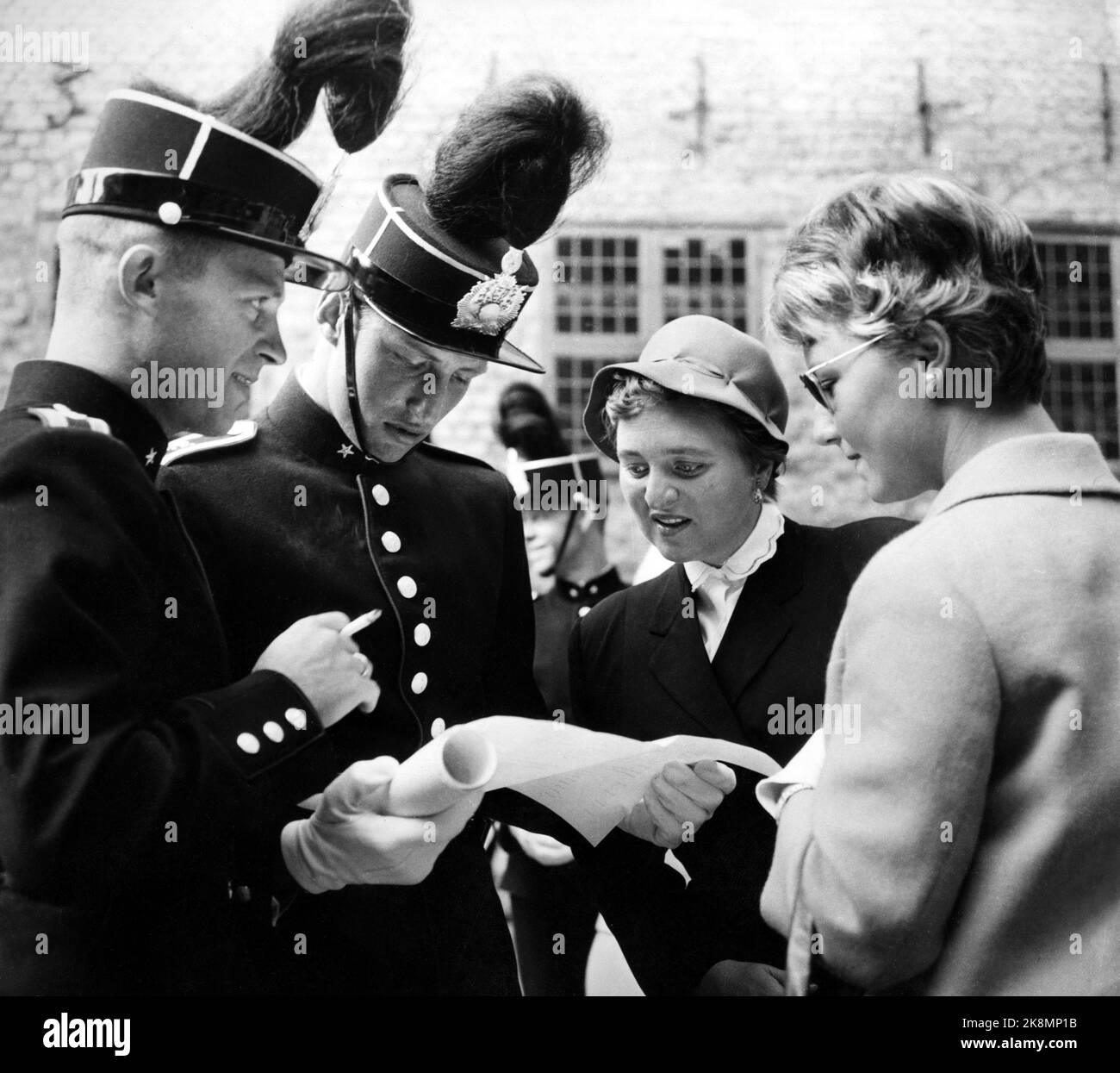 Oslo 19590828 Crown Prince Harald (No. two BCE) at the War School with an unknown lady, who was later identified as Sonja Haraldsen (t.h.). This is the first picture taken of them together. The Crown Prince has received exam witness burden. (The man t.v. is Colonel Børe Norland, later Guard Chief) NEG 4665 (lady # 2 FH in the picture is unidentified). Photo: Bjørn Glorvigen / NTB  NB! Must be credited to Bjørn Glorvigen! Stock Photo