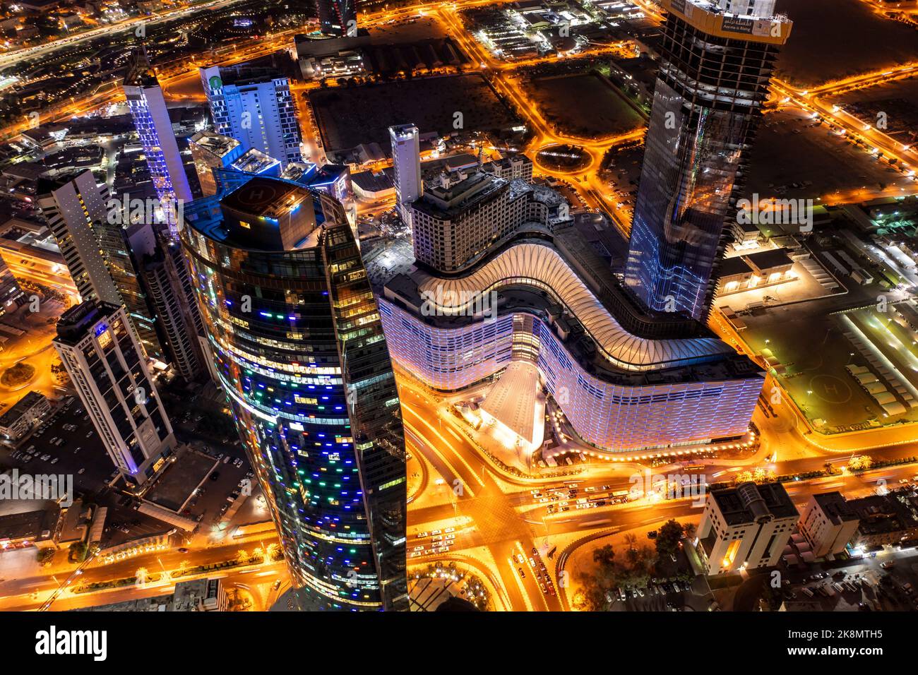 The aerial view of Al Shaheed Park and Assima Mall buildings at night Stock Photo