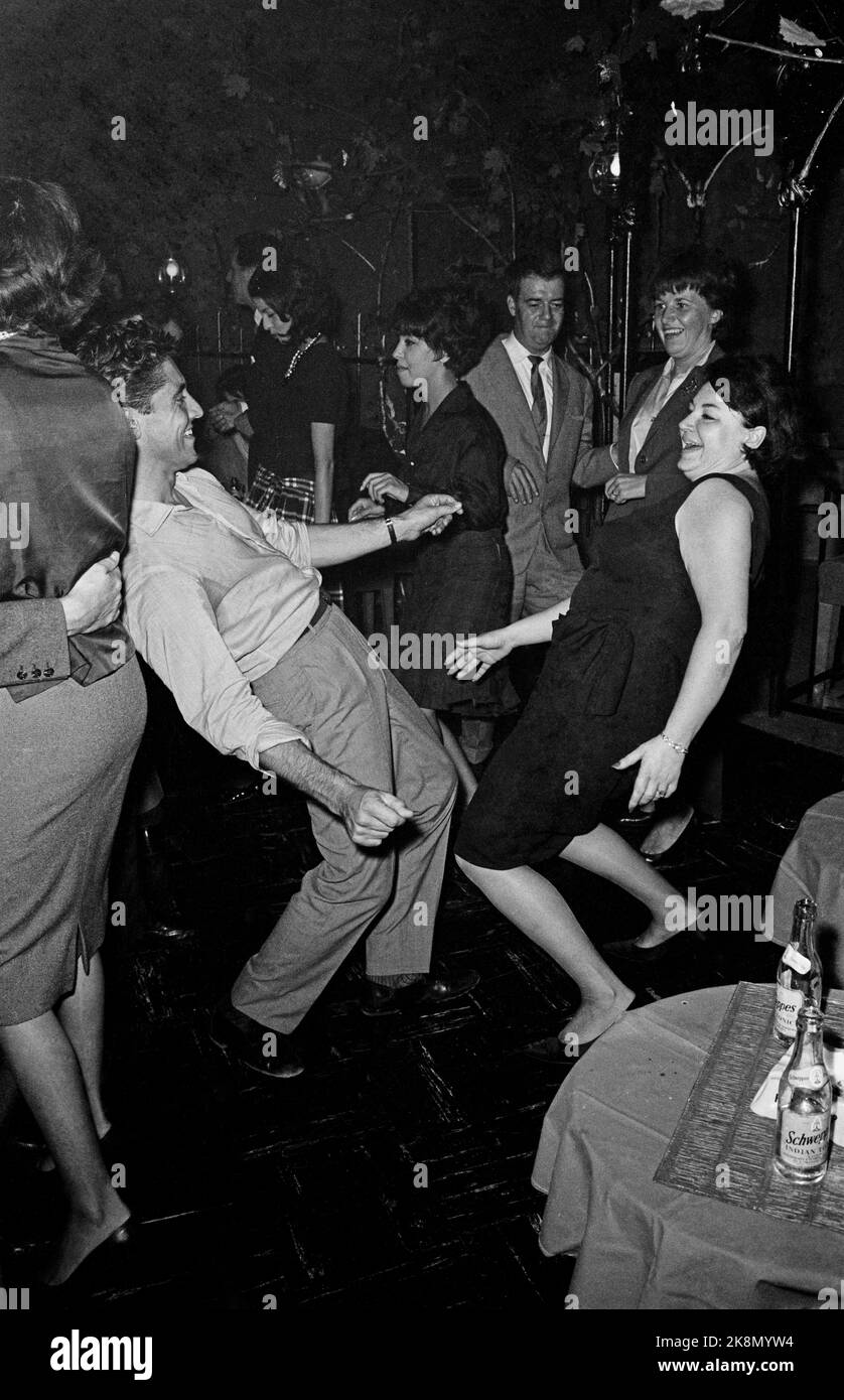 French singers Régine and Sacha Distel dancing at 'Chez Régine', located rue du Four in the 6th arrondissement in Paris. October 1961 Stock Photo