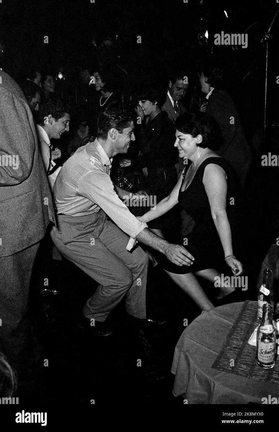 French singers Régine and Sacha Distel dancing at 'Chez Régine', located rue du Four in the 6th arrondissement in Paris. October 1961 Stock Photo