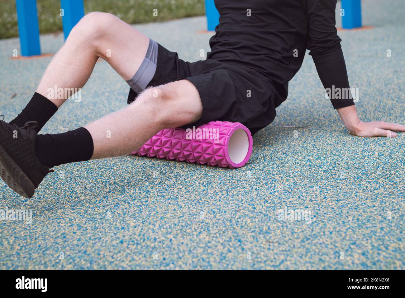 Fitness trainer exercises and warms up the lower part of the body with