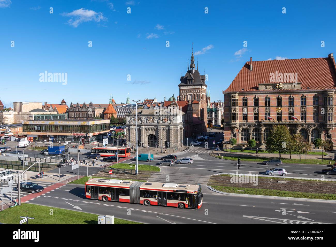 Gdansk, Poland - October 4, 2022: City traffic on Okopowa street with view to High Gate and Prison Tower, entrance to the Old Town Stock Photo