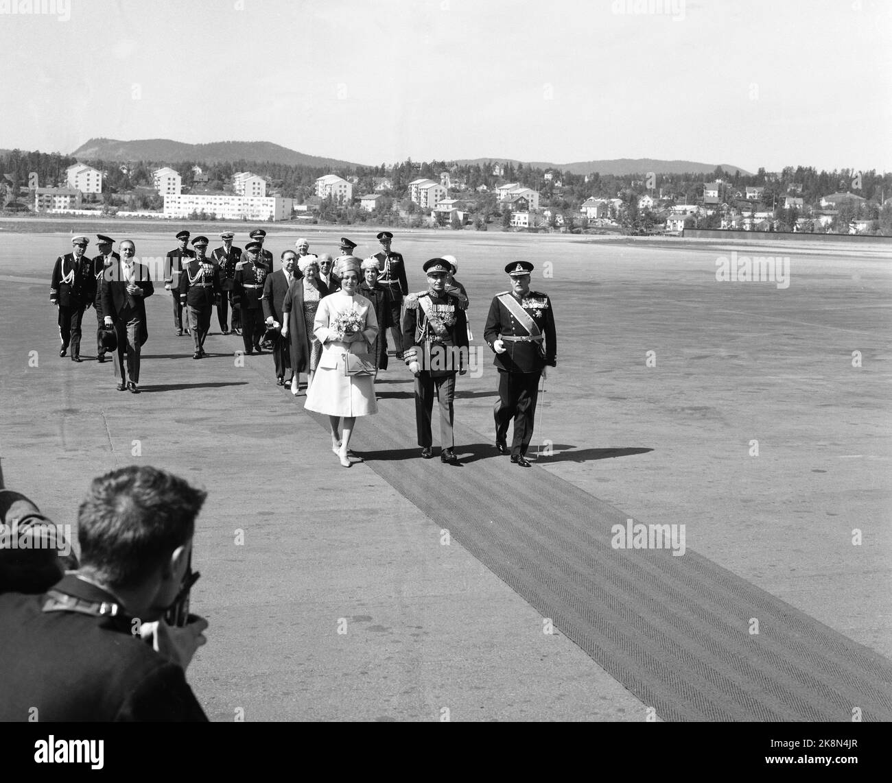 Norway on May 27, 1961. The Shah of Persia (Iran) with Queen Farah Diba, visits Norway. Here they meet by King Olav at Fornebu Airport. Photo: Current / NTB Stock Photo