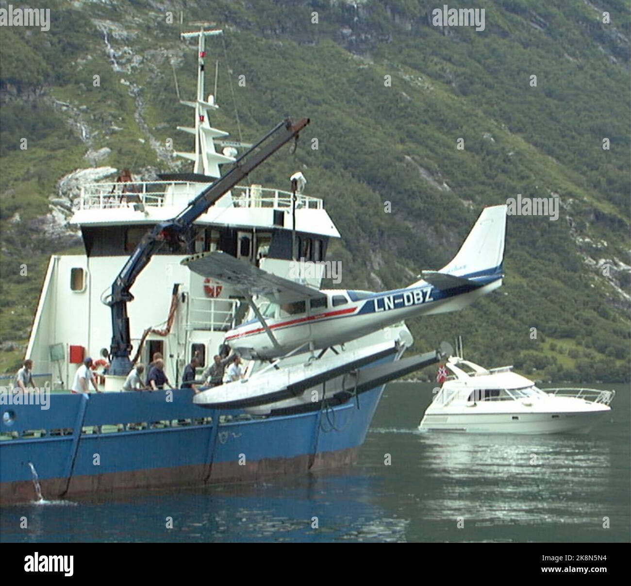 Geiranger. The wrecked Cessna wing is raised from the sea by the 'sea eagle' well boat on Sunday. Four German tourists lost their lives when the plane overturned under the country in the Geirangerfjord on Saturday afternoon. (Photo: Kjell Herskedal, NTB Plus) Stock Photo