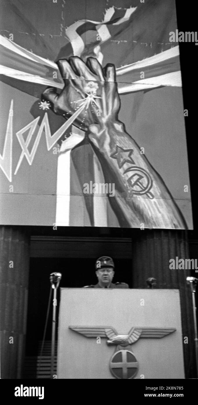 Oslo 19440515 Norway during World War II. Minister President Vidkun Quisling speaks at the University Square in Oslo, against what he calls the traitors in London, and the fight against Bolshevism. Quisling on the pulpit. German eagle and sun cross on the pulpit. In the background, a propaganda poster against Bolshevism. A hand with tattooed Russian symbols, stars, hammer and sickle tears the cross out of the Norwegian flag. Photo: Kihle / NTB / NTB Stock Photo