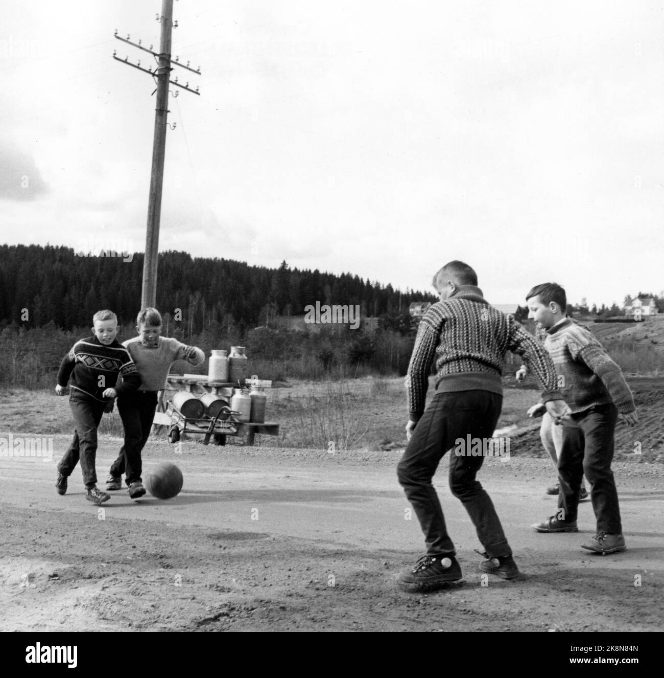 19620510-boys-play-loop-football-kick-football-on-bygdeveg-photo-hi-res