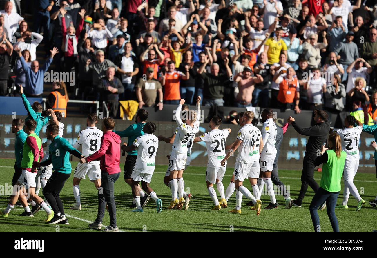 Swansea, UK. 23rd Oct, 2022. Swansea city players and staff celebrate