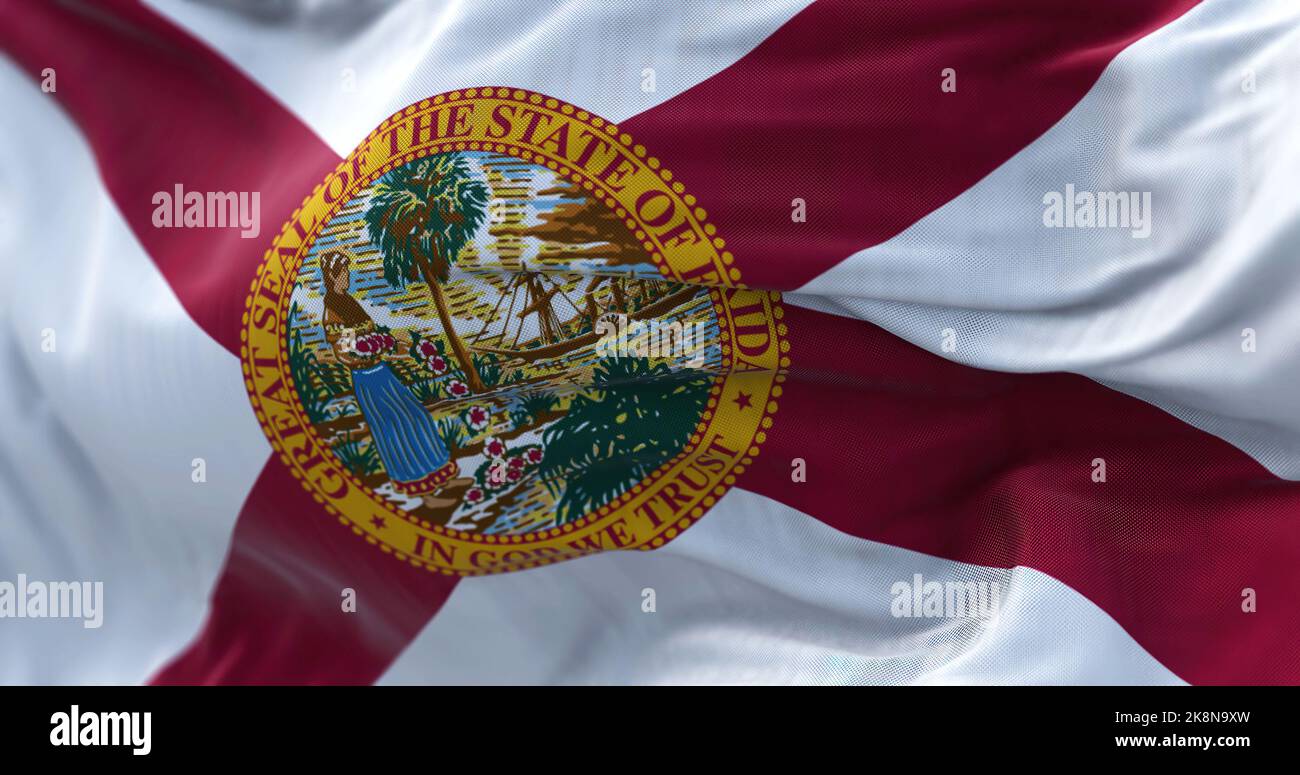 Close-up view of the Georgia state flag waving in the wind. Florida is a state of the United States of America. Fabric textured background. Selective Stock Photo