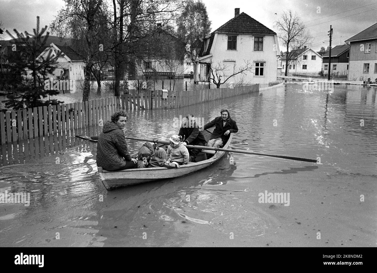 Lillestrøm 19660523 Flood hits Lillestrøm hard. Most streets are now underwater. Row boat is the only usable means of communication in Elvegaten. Here is a family on the way down Elvegata in a boat. Photo: NTB / NTB Stock Photo