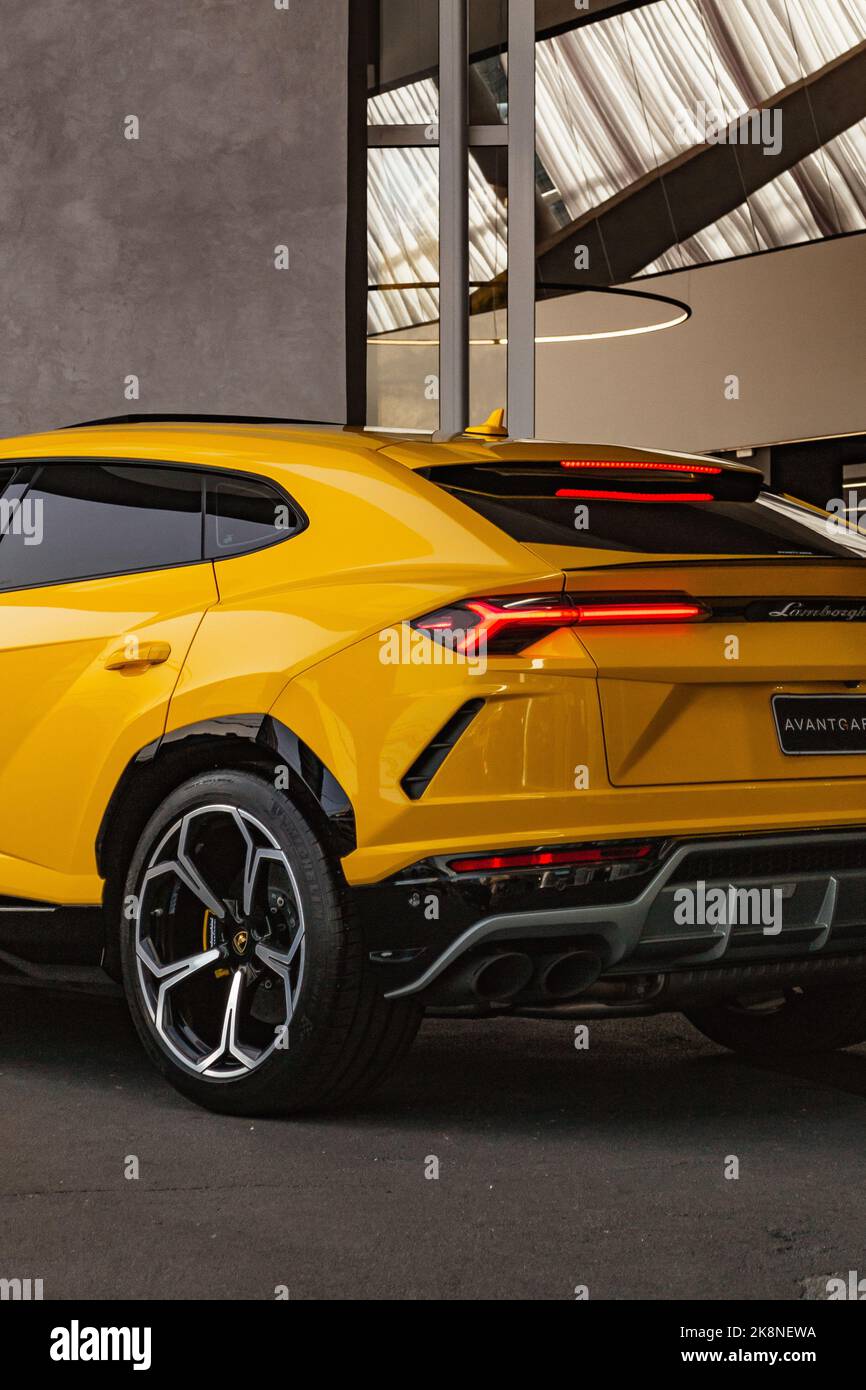 Urusb Rear A Cropped image of a Lamborghini Urus SUV Yellow Rear 3-4 Vertical ...