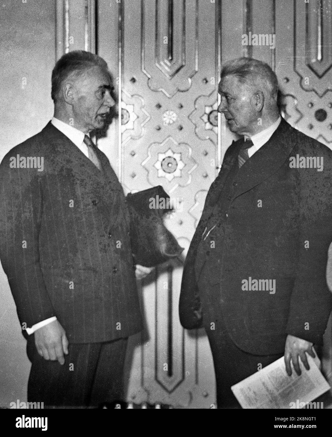 Oslo 19400406: Foreign Minister Halvdan Koht (TV) in the Storting after his speech to the Storting's representatives, three days before the outbreak of the war. (The person th is unknown and the glass plate is damaged) Photo: NTB Stock Photo