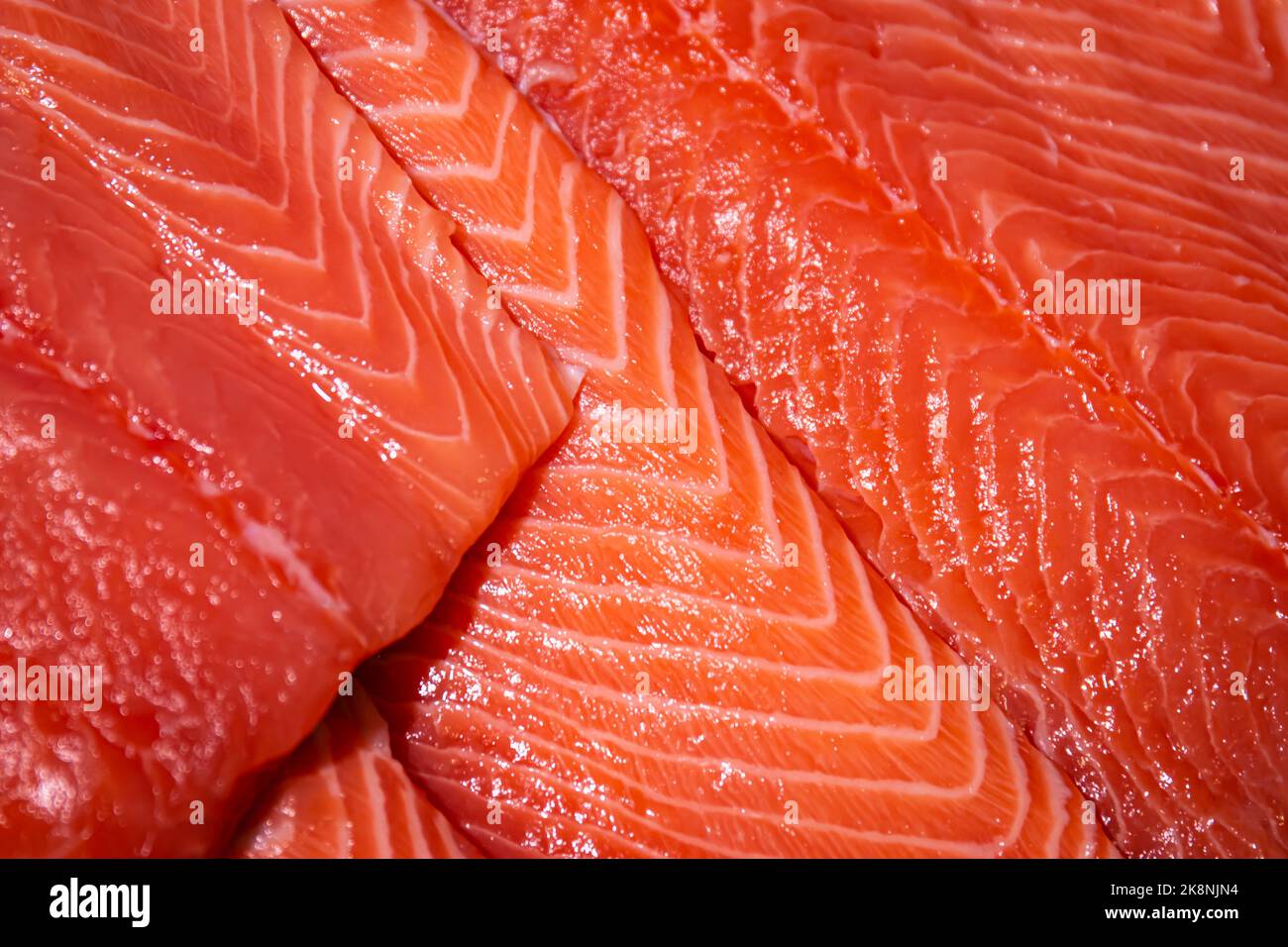 Raw salmon, trout close-up on the showcase of a seafood store. Stock Photo