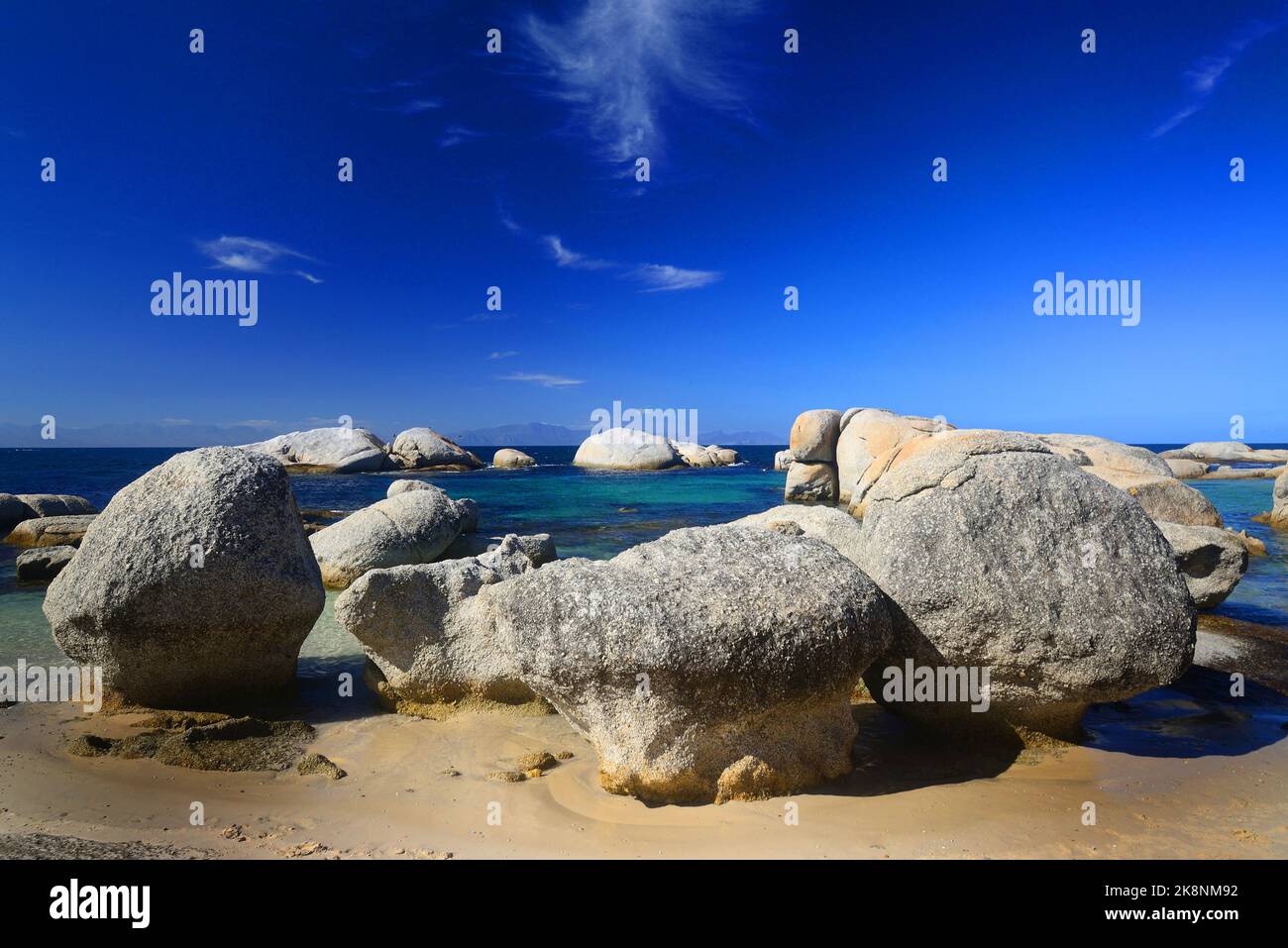A circle of rocks around water on Boulders Beach, Simon's Town, South Africa Stock Photo