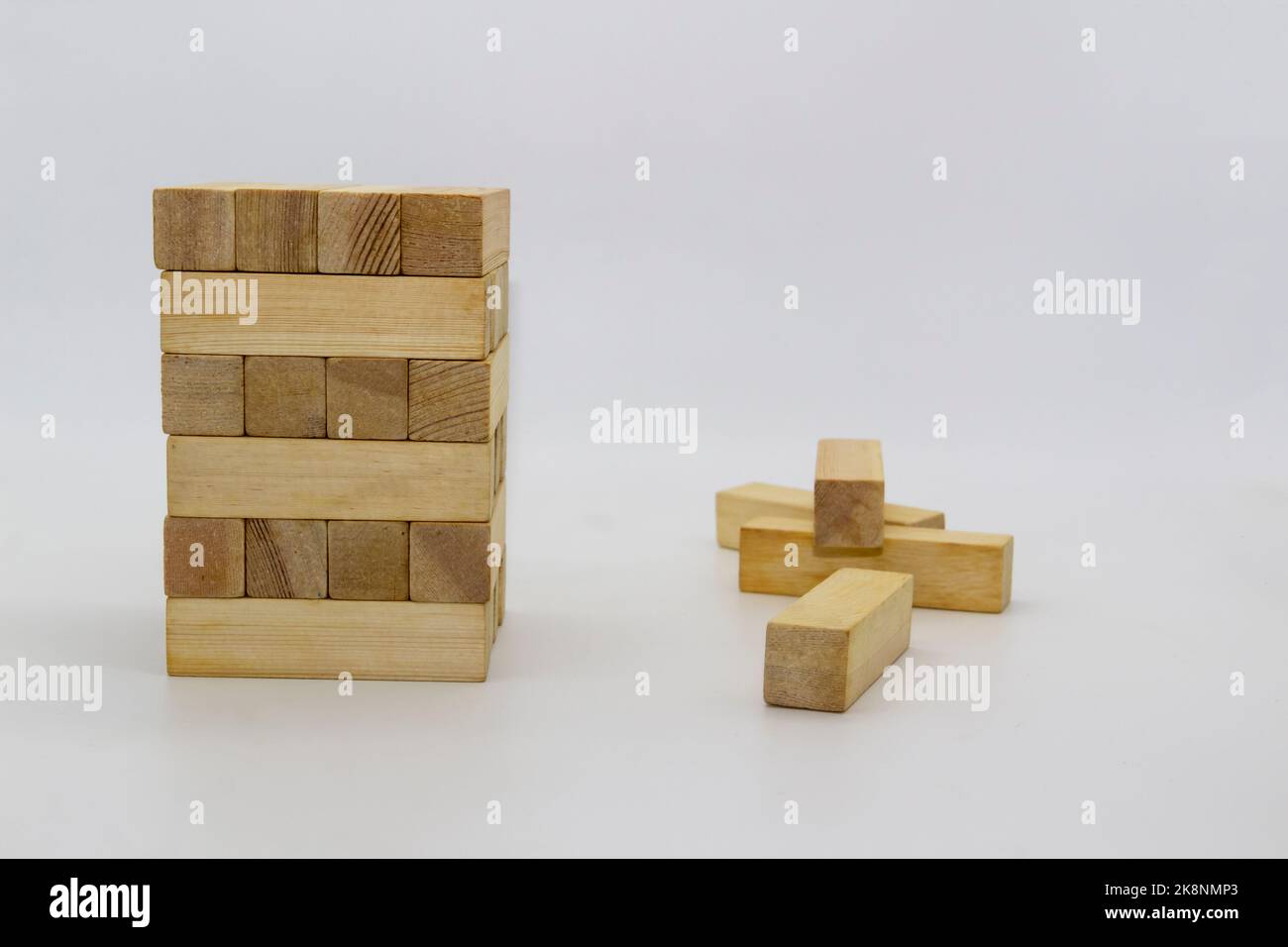 Tower wooden block, builds tower from wooden blocks against white ...