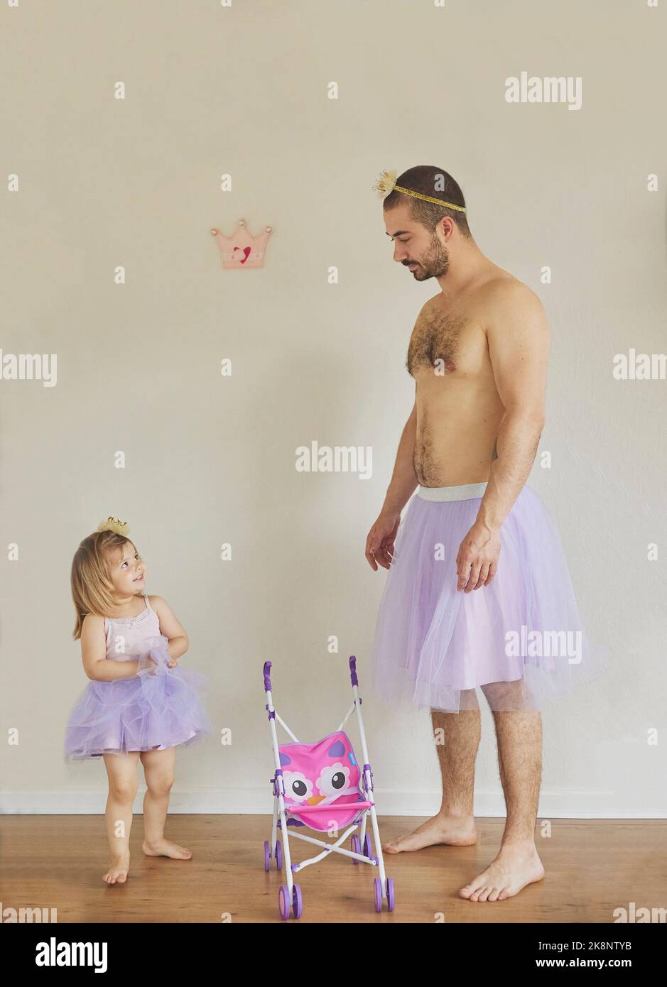 Father and daughter play dressed up as princesses Stock Photo Alamy