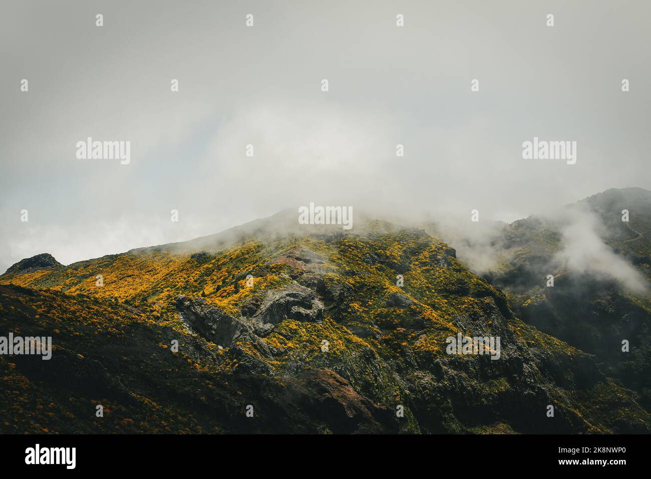 A landscape of a mountain range covered in clouds Stock Photo - Alamy
