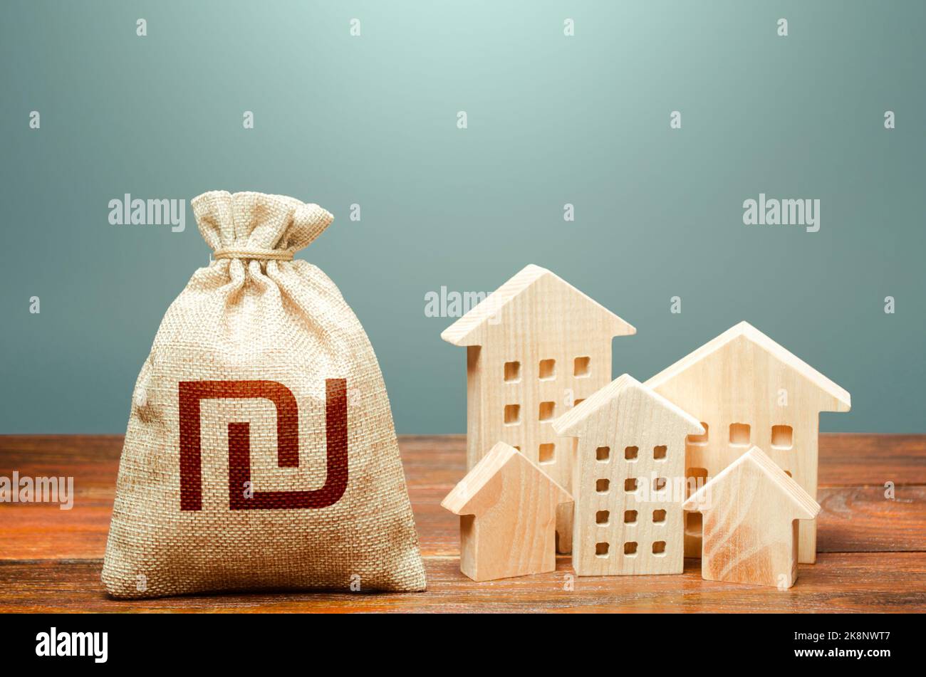 Houses and israeli shekel money bag. Overheated market. Community