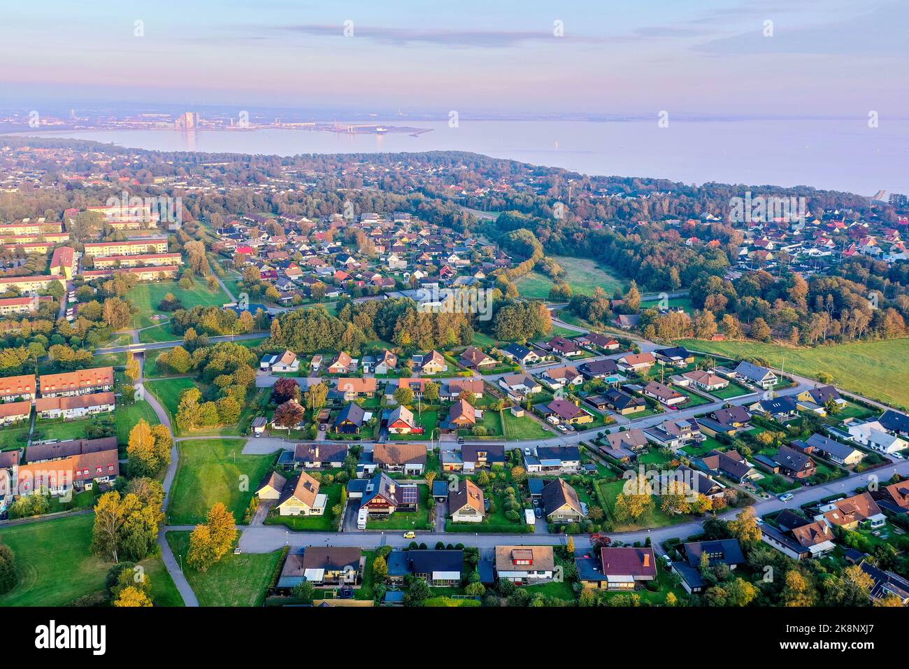 An aerial, drone landscape view of the city of Halmstad on the coast of south west Sweden, taken as dusk in the summer. Stock Photo