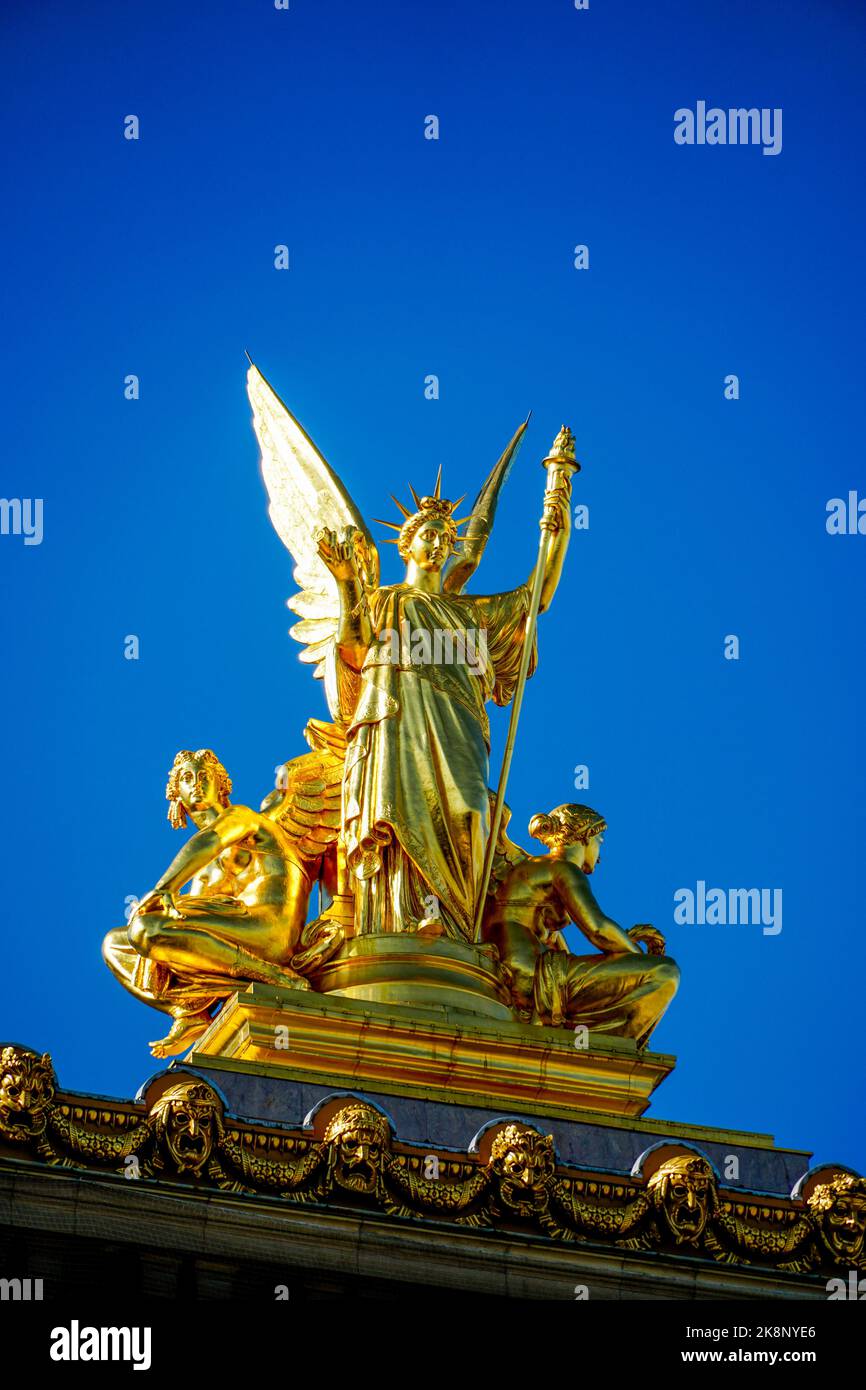 The golden statue of poetry on top of the opera in Paris, France Stock Photo