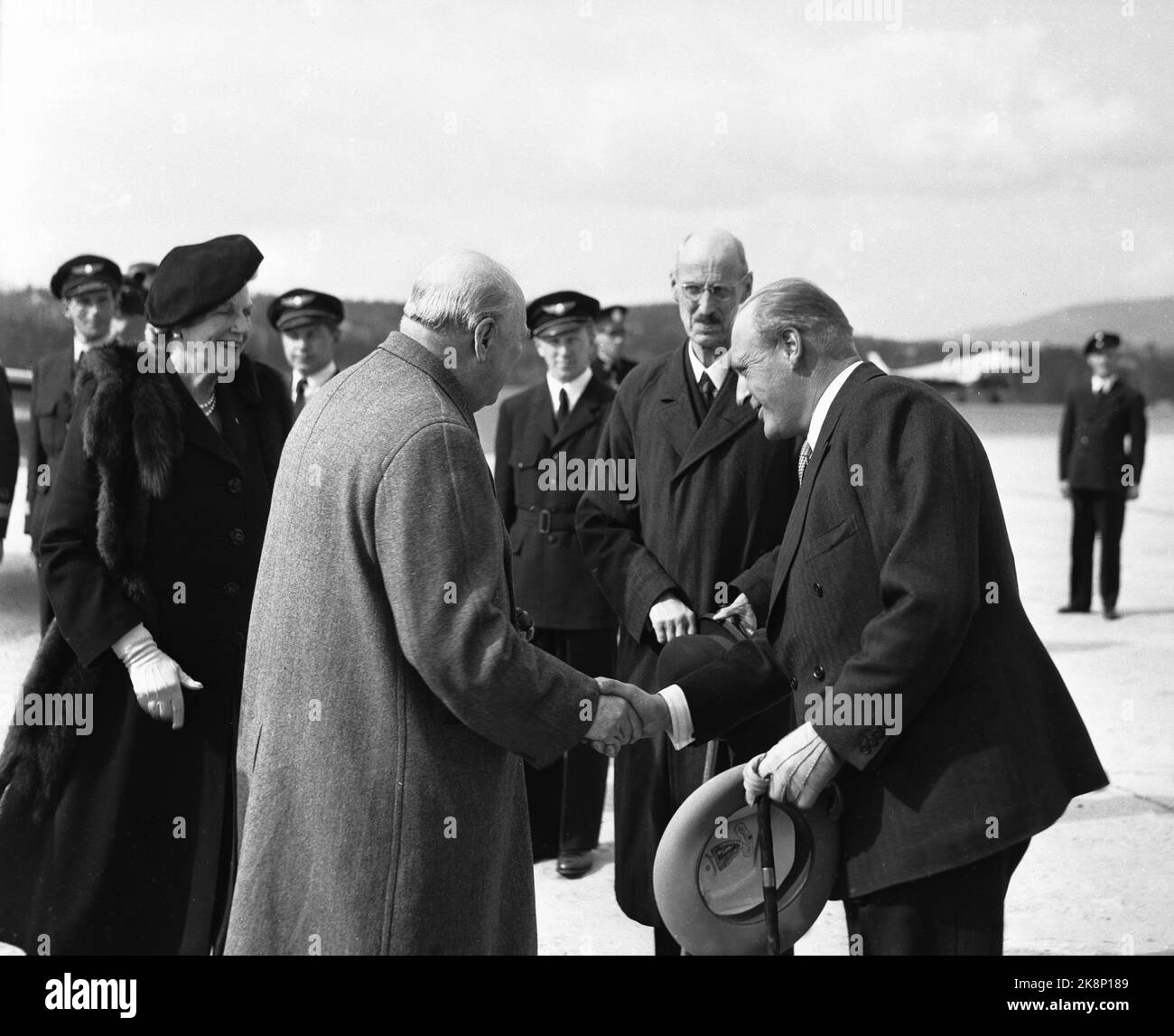Fornebu 19480512. Prime Minister of the UK Winston Churchill visits Norway with his wife (behind t.v.). At Fornebu Airport they were welcomed by King Haakon (middle) and Crown Prince Olav (t.h.). Photo: NTB Stock Photo