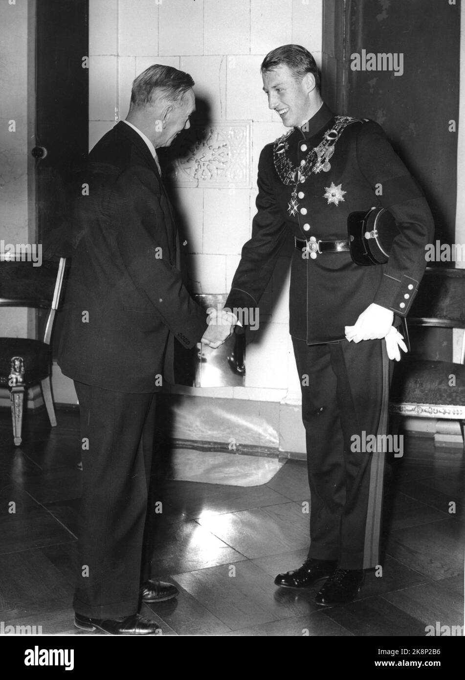 Oslo February 21, 1958. Crown Prince Harald is congratulated by Storting President Oscar Torp on the 21st birthday. Reception at the castle. Stock Photo The Picture Center / NTB Stock Photo