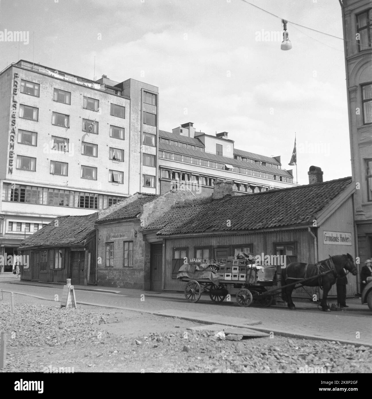 Oslo 19510609 Greenland. Salvation Army The building is located in the intersection of Lakkegata / Breigata. The picture is taken just where the traffic machine passes the Greenland camp today. Classic funki building with window straps on the third floor. Old cars in a primitive parking lot. Greenland's planer with horse and cart in the foreground. Photo: Stage / NTB / NTB Stock Photo