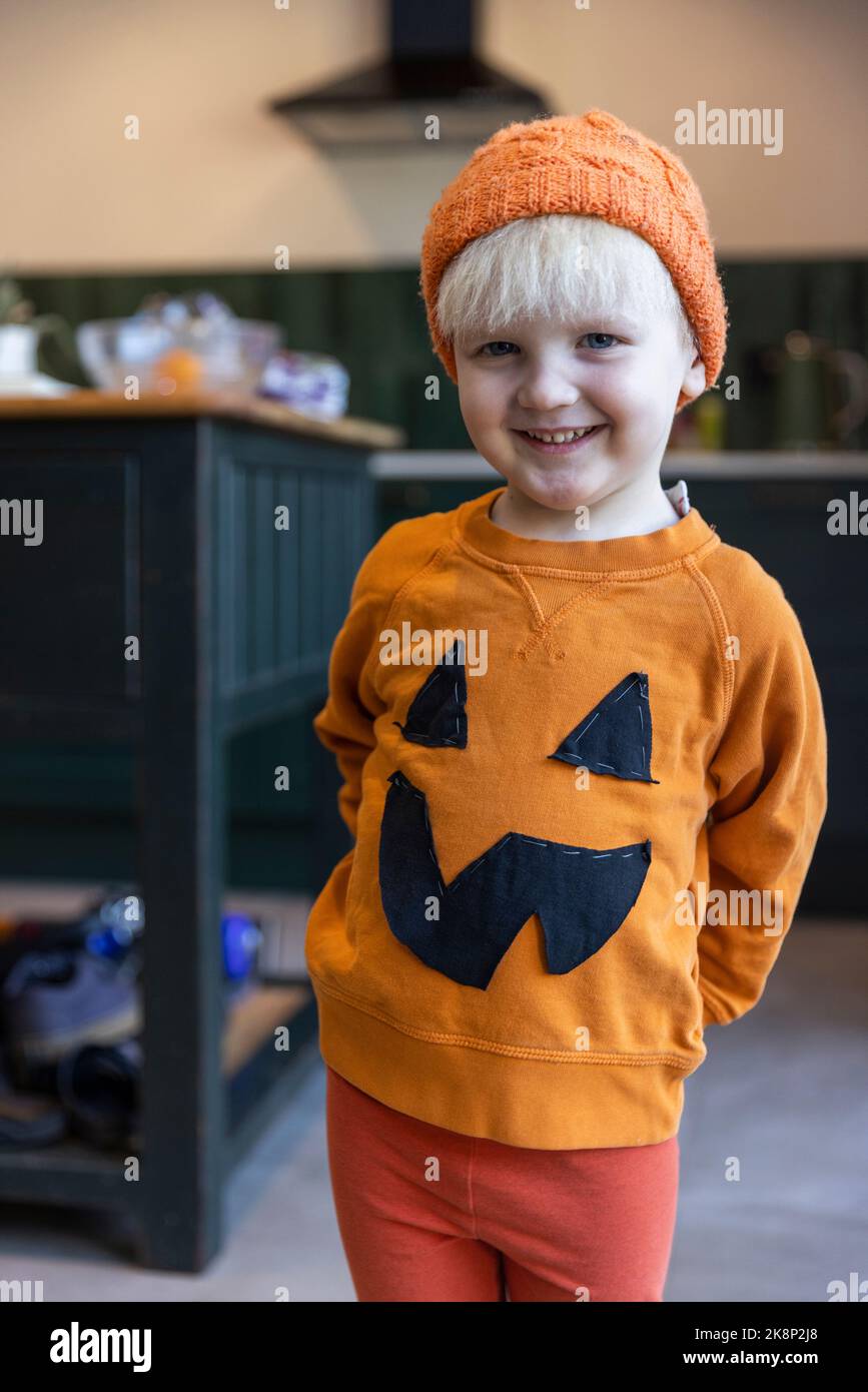 a-little-boy-wearing-a-homemade-pumpkin-halloween-costume-stock-photo