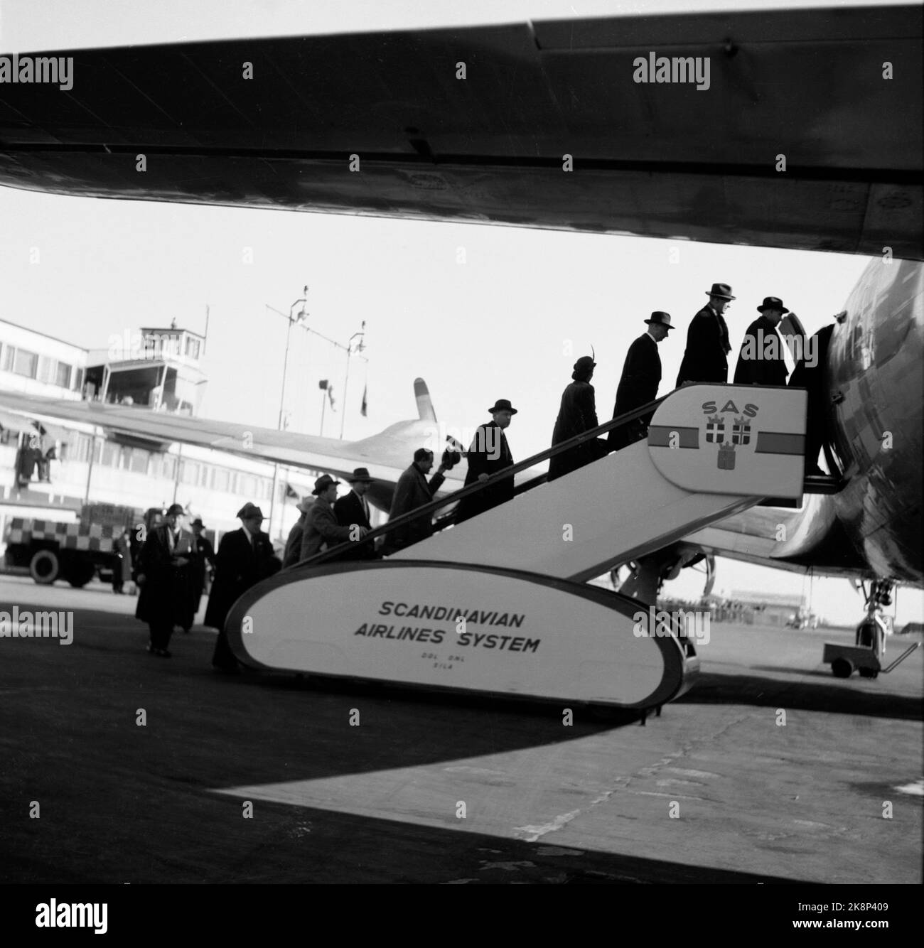 Copenhagen, Denmark, 1948 SAS FLYRUTE COPENHAGEN / NEW YORK. Passengers board the plane. The