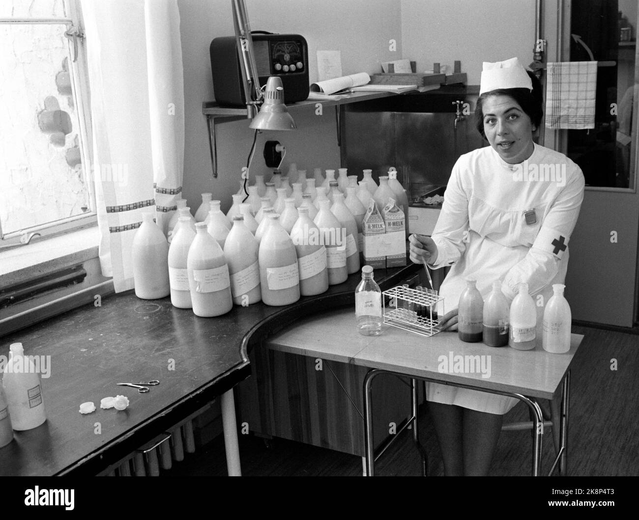 Oslo June 1962 After the Soviet start with nuclear test blasts, it has become necessary to control the content of radioactivity, such as the substances caesium and strontium 90 in i.a. milk. In the State Radiological physical laboratory at Ullern, Norway is radioactively mapped. Here, the Red Cross Sister Wenche Pedersen analyzes radioactivity in blood and milk. Photo: Aaserud / Current / NTB Stock Photo