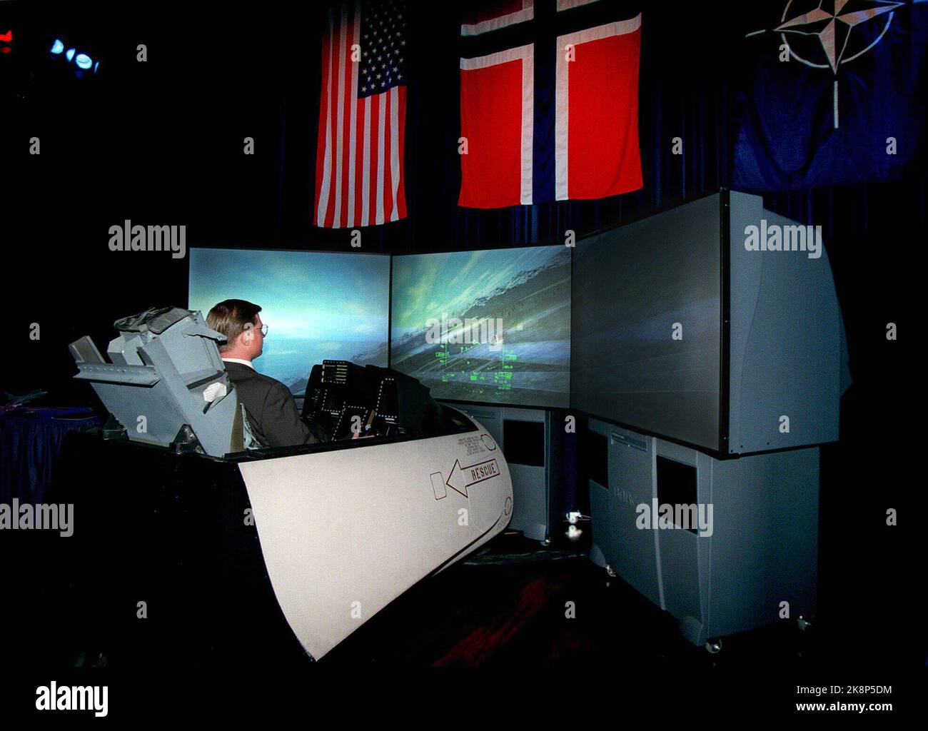 Doug Miller from Lockheed Martin tests the new F-16 Block 50n simulator in the Oslo Concert Hall. The F-16 aircraft type is one of the relevant fighters that Norway assesses when the air defense goes to the purchase of new aircraft. On Thursday, representatives from the Armed Forces and the press received a trial in the simulator. The F-16 conducted its first trial in 1978, and Norway was one of the first countries to buy the fighter jet. Today, 21 countries have acquired the F-16 for their air defense. (Photo: Roar Vestad, NTB Plus) Stock Photo