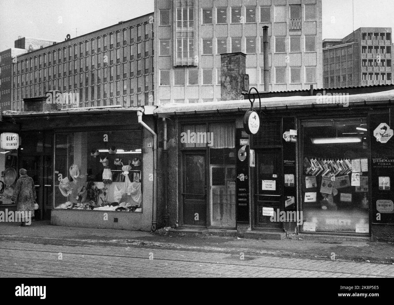 Oslo 19630115. Vestre Vika, environment in the old small stores in Engen. Shop with exhibition windows. In the background new business farms and offices. Photo: NTB / NTB Stock Photo