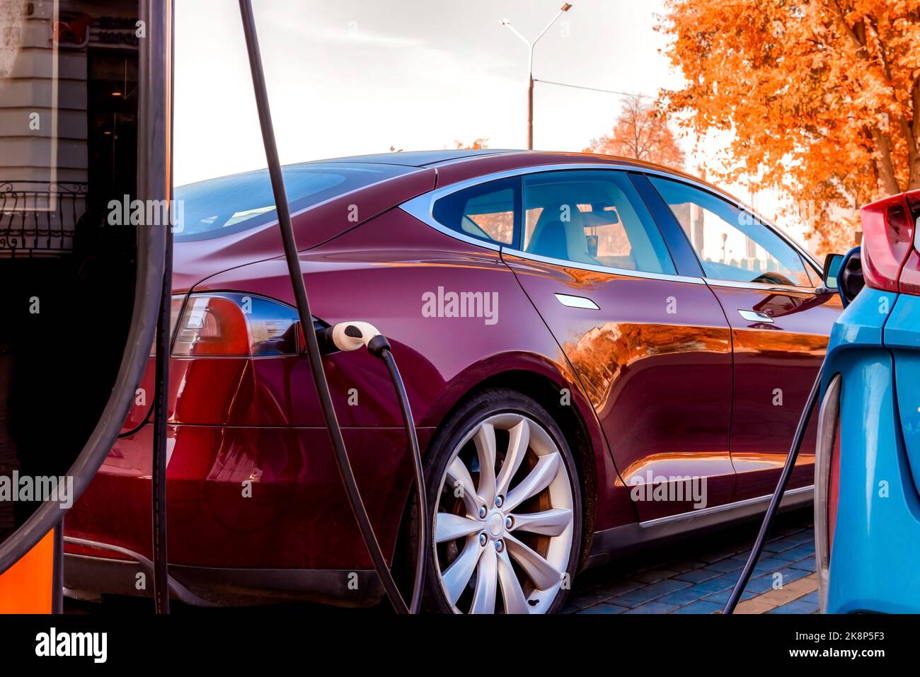Electric car at the charging station. Ecology. Eco-friendly transport ...