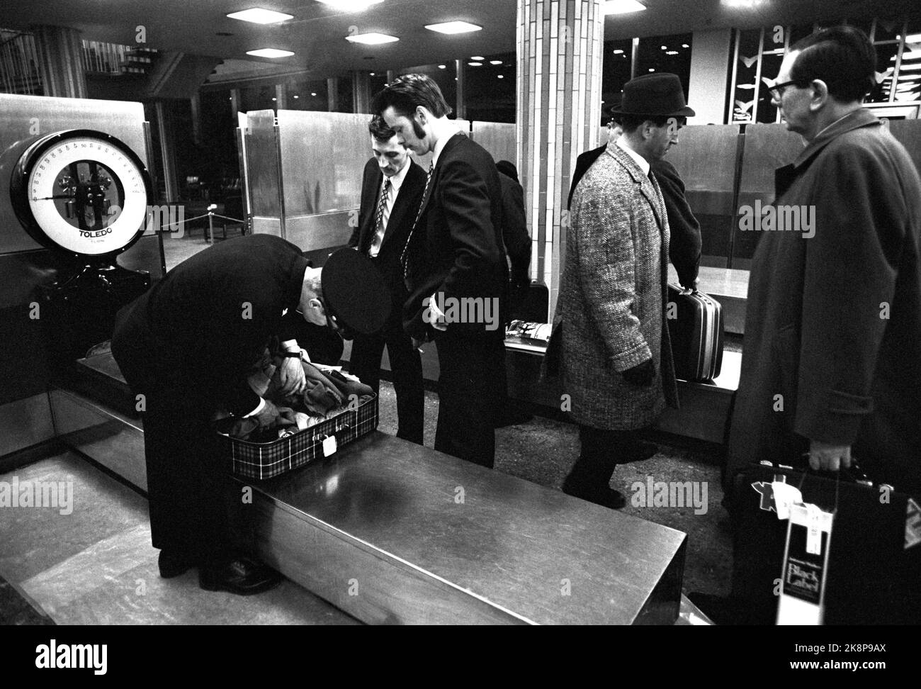 Fornebu February 1970 From Oslo Airport Fornebu. What happens at an airport during the day? Passengers on the way through customs after arrival. Toller checks a suitcase. Photo: Per Ervik / Current / NTB Stock Photo